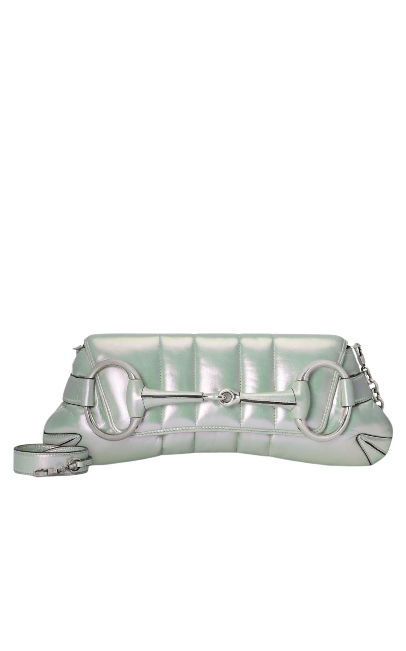 Gucci Iridescent Green Horsebit Chain Medium Shoulder Bag
This product is embedded with NFC technology  
Signature Horsebit detail  
Silver-toned hardware  
Asymmetrical Horsebit  
Foldover top with magnetic fastening  
Single top handle
