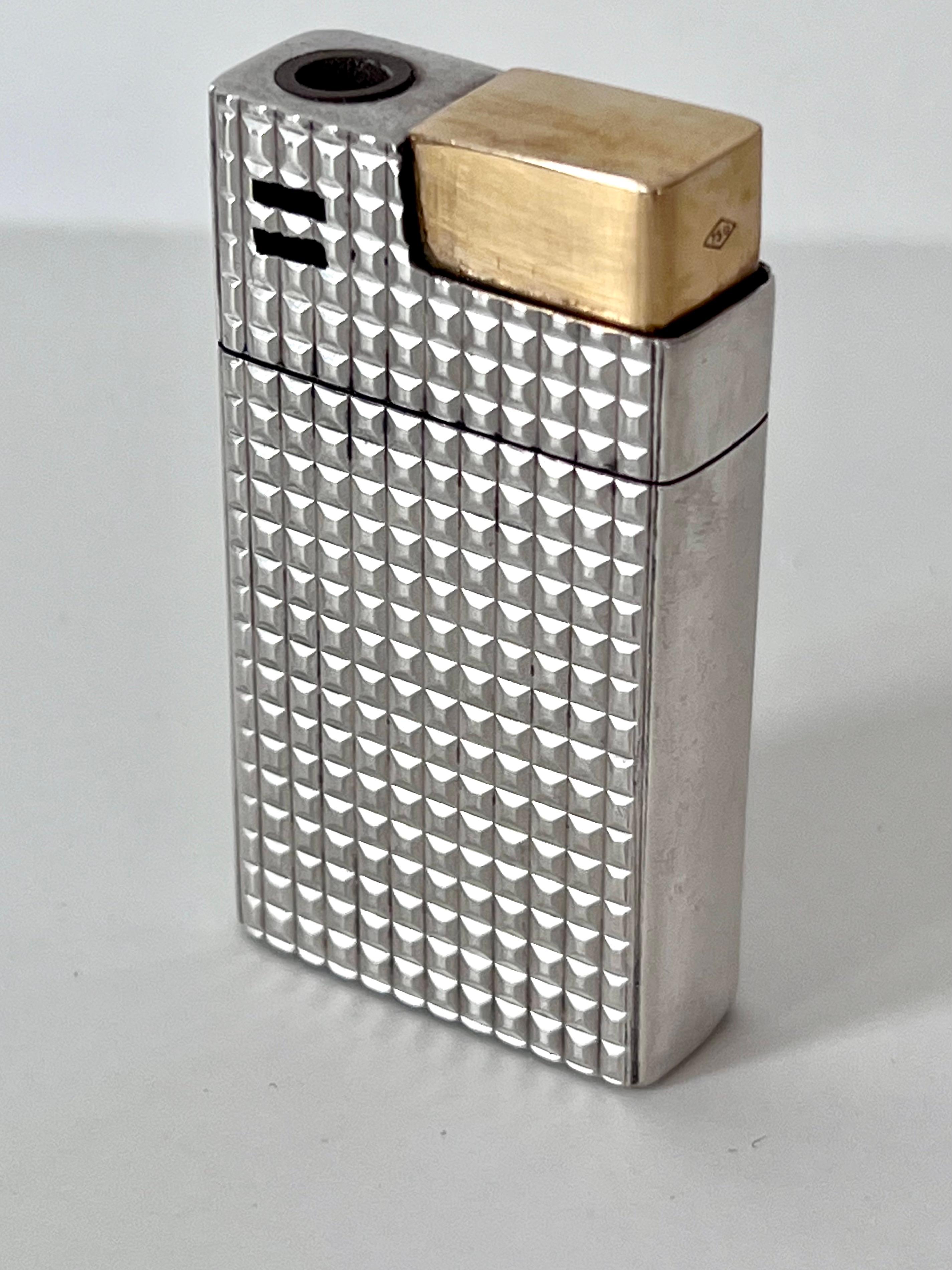 Stunning Gucci Italy signed Cigarette, Cigar or 420 Lighter.  A Waffle pattern sterling that is print resistant... with a  solid 18k Gold Strike.  The perfect compliment to any bar, pocket or cocktail table.  In the classic design of Gucci one