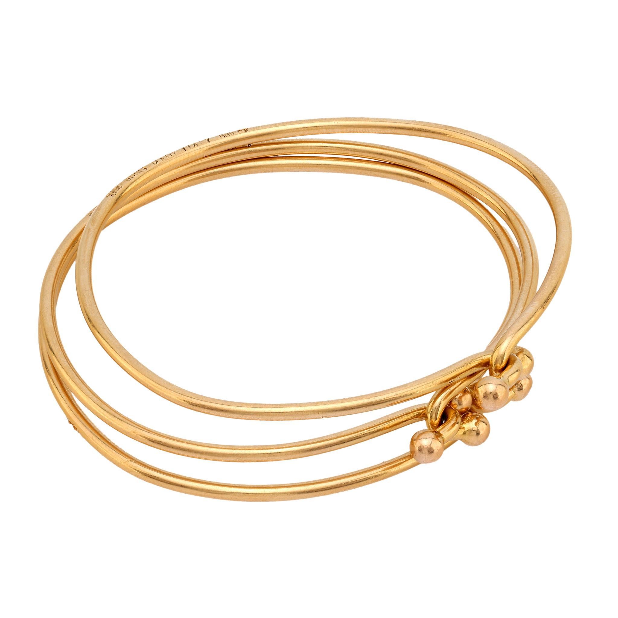 Modern Gucci Italy 14k yellow gold set of three interlocking bangles