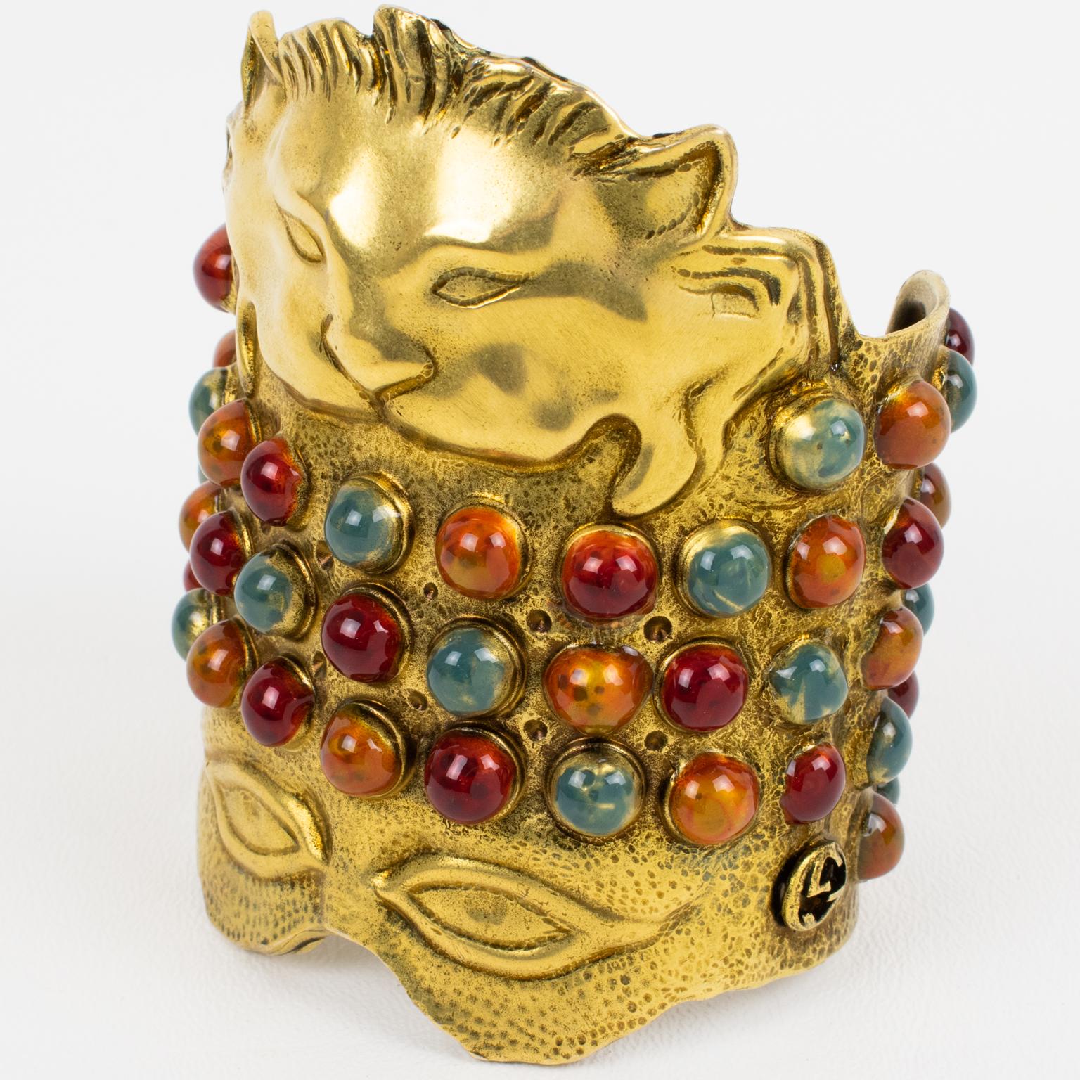 Alessandro Michéle created this fabulous Gucci, Italy massive cuff bracelet for the Gucci Cruise Collection 2020 runway show. This cuff bracelet is patinated gilded metal and features a mask inspired by Greek and Mesopotamian antiquity. The piece is