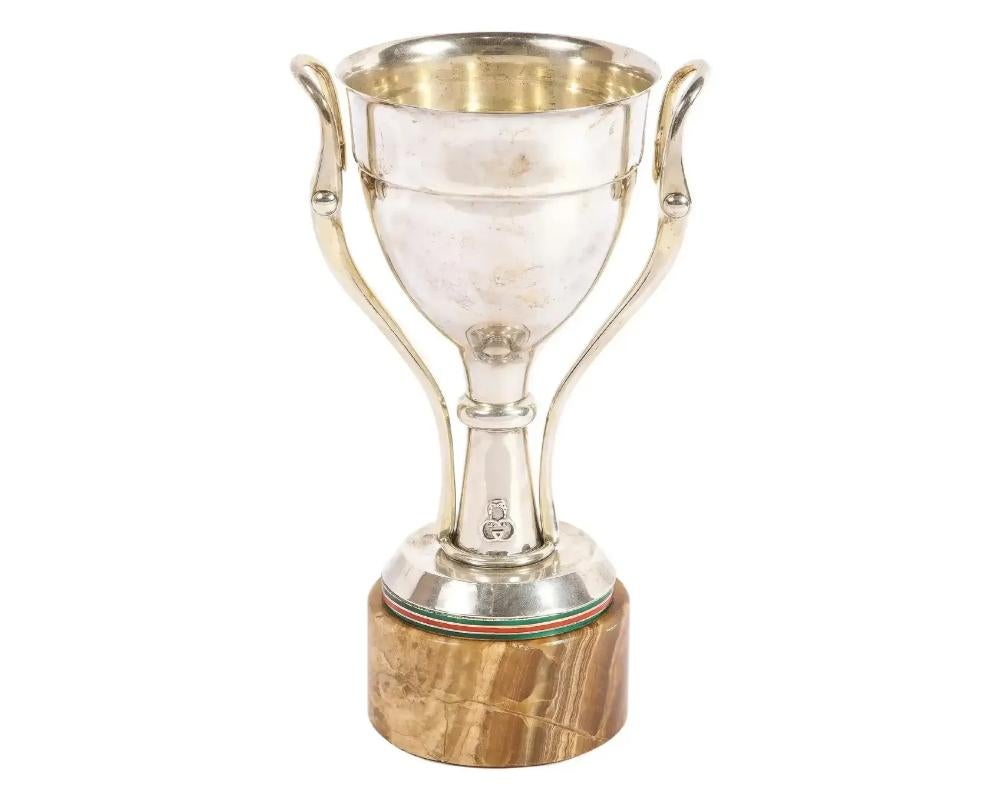 Gucci Italy, a rare sterling silver, enamel, and marble trophy cup, C. 1970

With double GG insignia at bottom and stamped 'GUCCI ITALY 925' along base.

Measures: 10