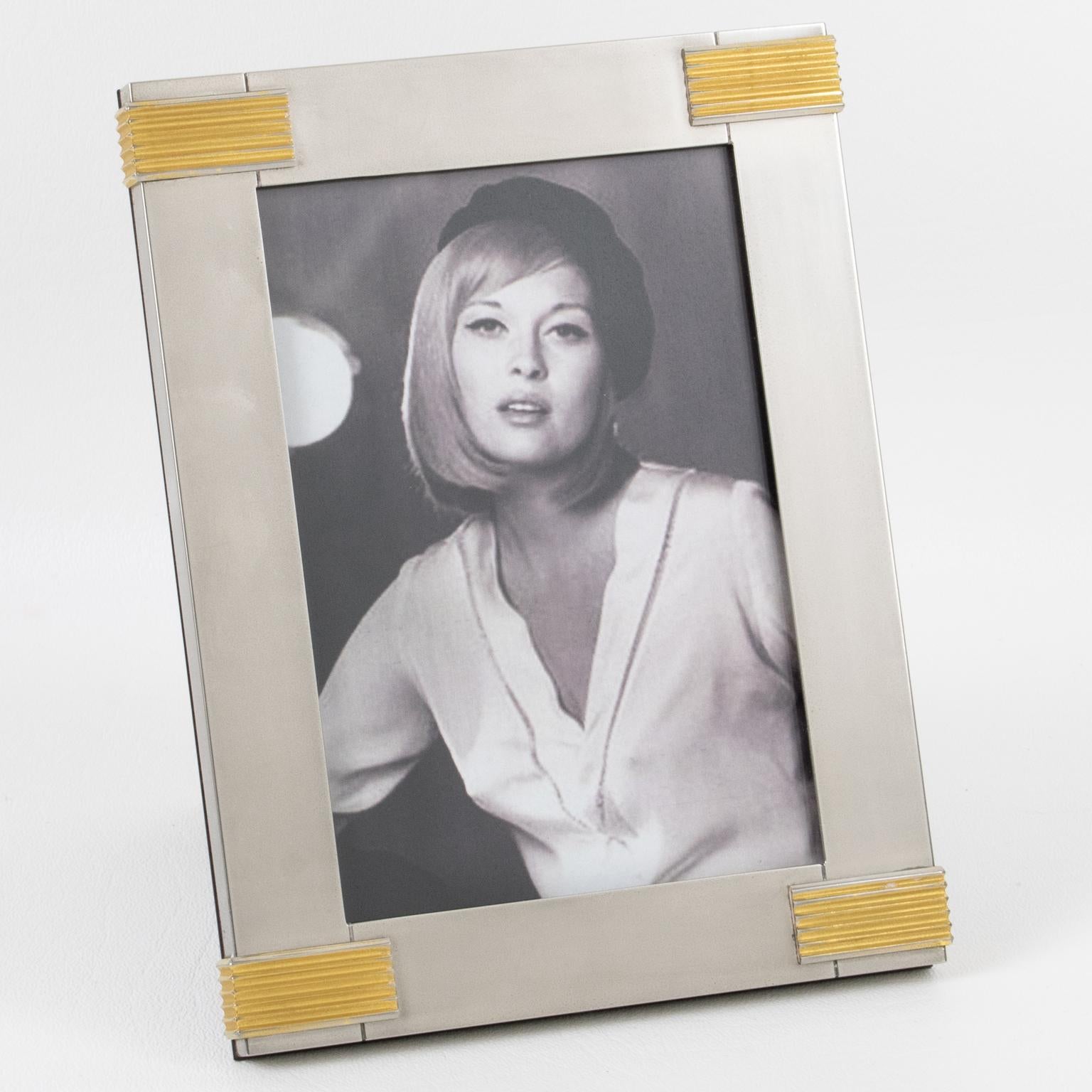 Italian designer Gucci crafted this elegantly classic and iconic picture photo frame in the 1980s. The piece boasts a timeless and minimalist chromed metal and brass geometric design. The rich high gloss walnut wood back and easel have chromed metal