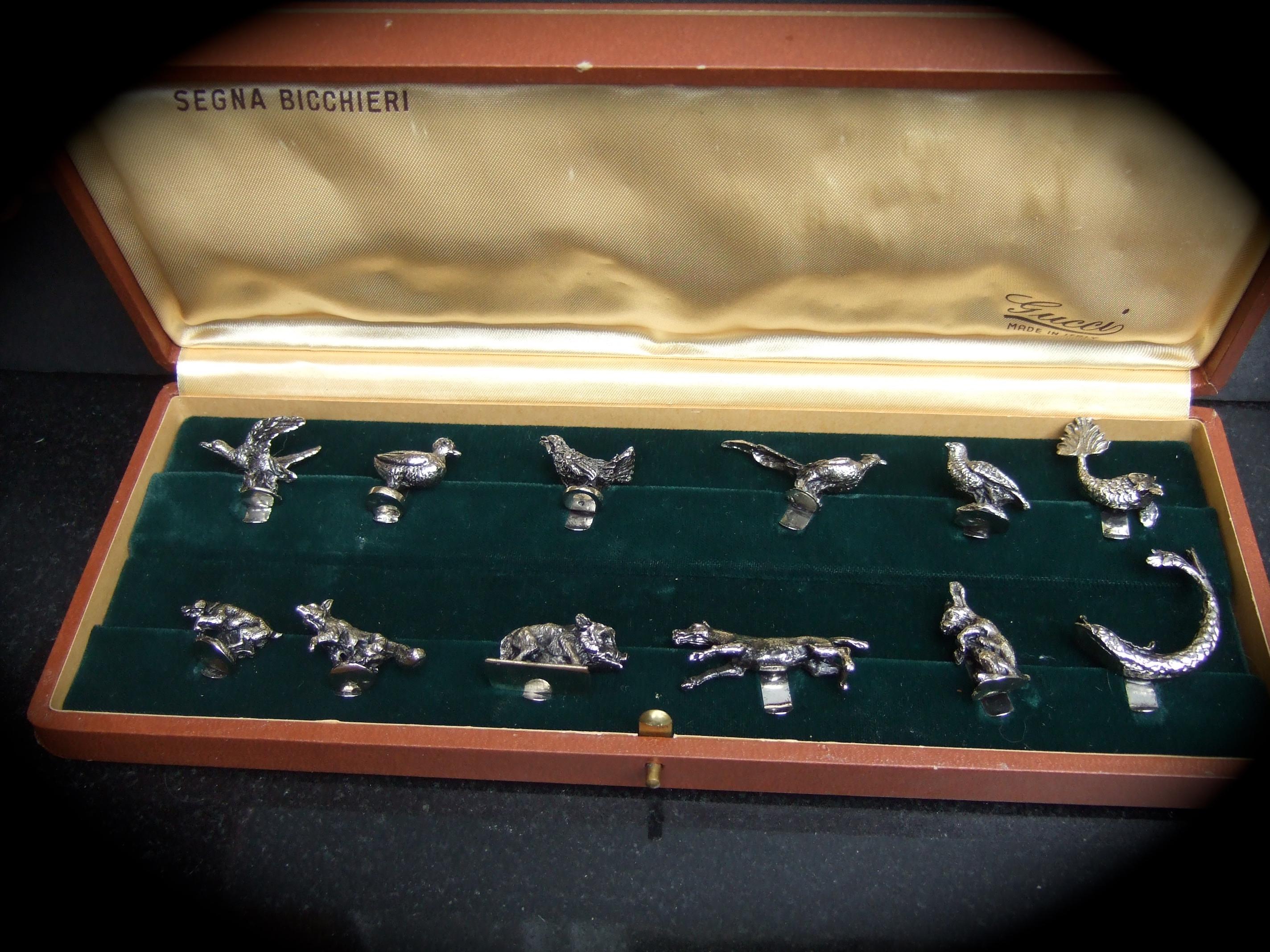 Gucci Opulent silver plated animal menagerie of fine dining place card holders in Gucci box c 1970s 
The elegant collection of twelve silver plated animals are designed with a clip to place
the name of dining guest. Perfect for holidays or special