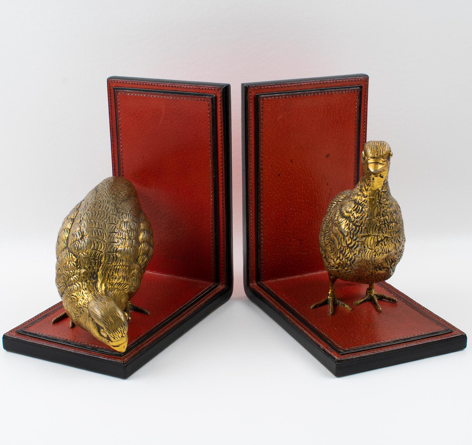 Gucci, Italy, designed this superb pair of handcrafted leather and metal bookends in the 1970s. This rare large-scale set features two gilded metal partridges resting on a hand-stitched leather 