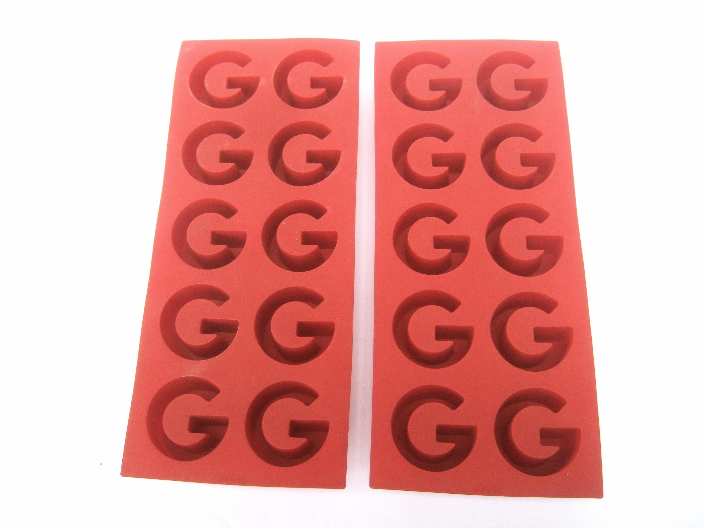 GUCCI Italy Pair of rubber ice tray molds c 1980s
The set of rubber ice trays are designed with Gucci's
iconic G initials throughout 

Makes a stylish barware accessory perfect for entertaining  
The rubber molds are stamped Gucci Italy 
Each tray