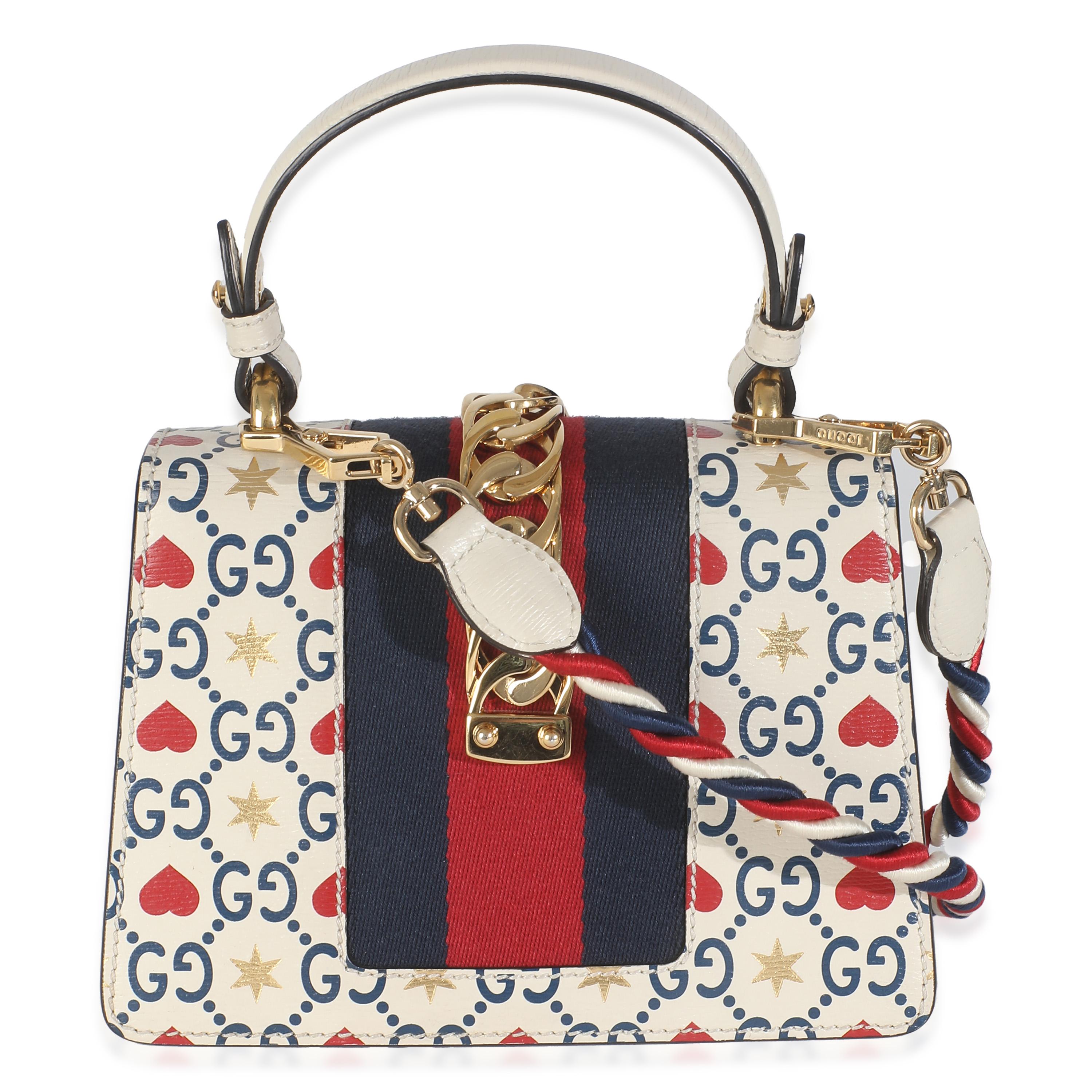 Listing Title: Gucci Ivory Calfskin Valentine's Day Mini Sylvie Top Handle
SKU: 146241
Condition: Pre-owned 
Handbag Condition: Very Good
Condition Comments: Item is in very good condition with minor signs of wear. Scratching along hardware. Glue