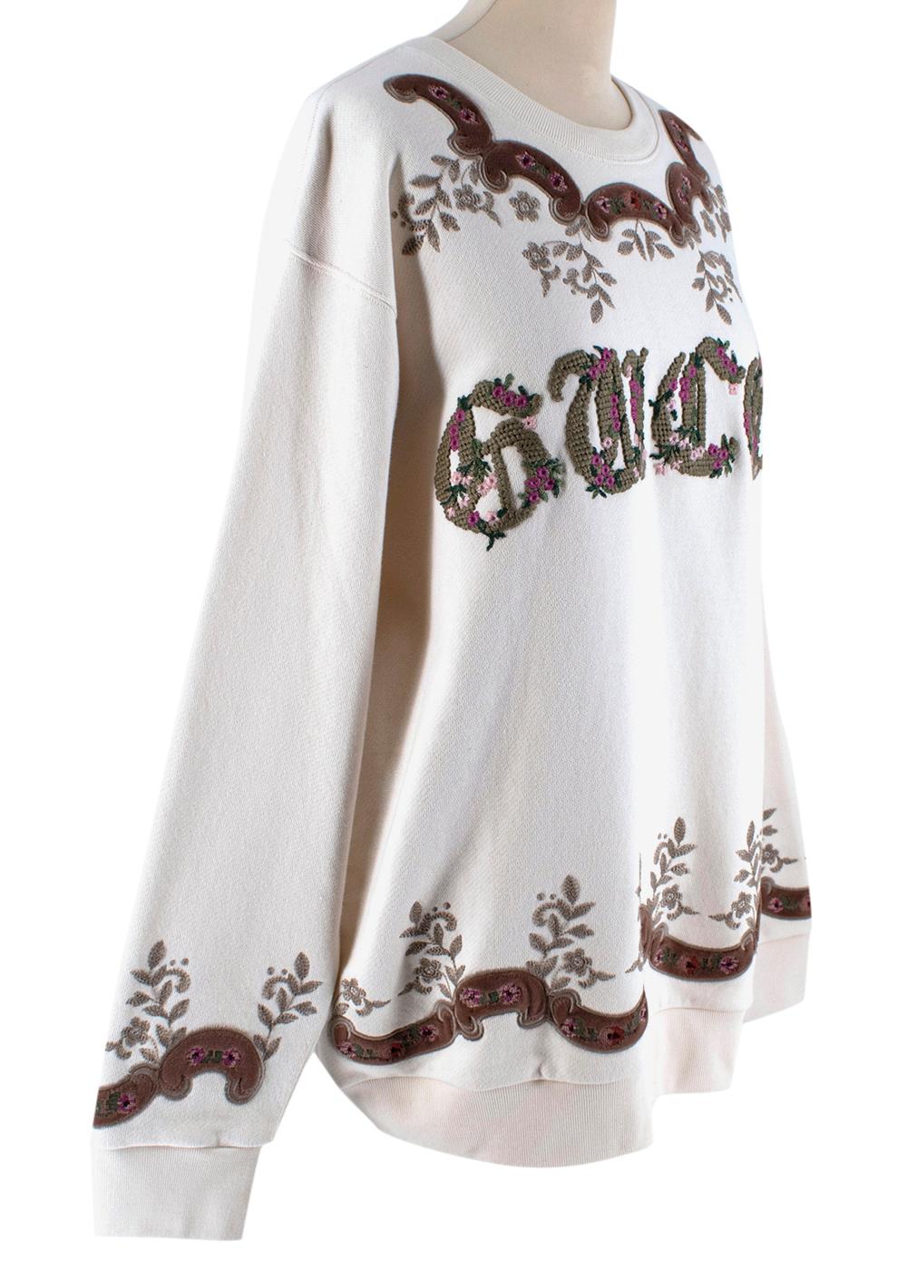 Gucci Ivory Cotton Floral Embroidered Oversized Jumper

-Soft cotton material
-Gucci logo embroidery on front with flower detailing
-Stunning, soft floral embroidery bordering hemlines
-Ribbed hems
-Crewneck style
-Oversized, relaxed fit

Materials: