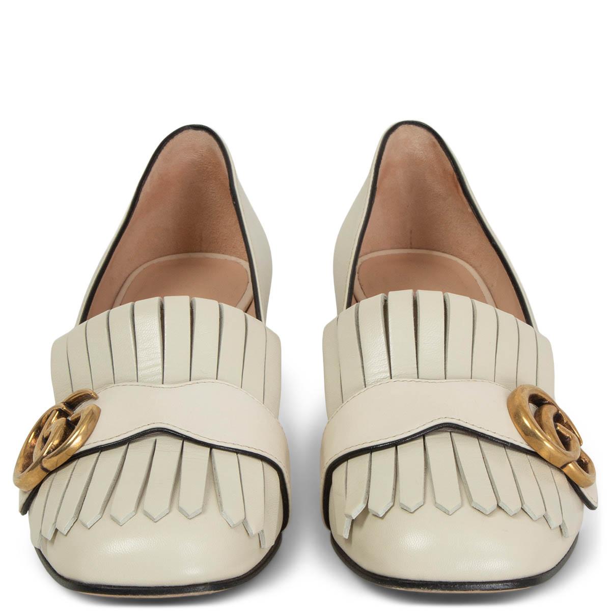 100% authentic Gucci Marmont mid-heel pump in ivory calfskin with Double G antique gold-tone hardware detail on fold over fringe. Have been worn and are in excellent condition. Come with dust bag. 

Measurements
Imprinted Size	36
Shoe Size	36
Inside