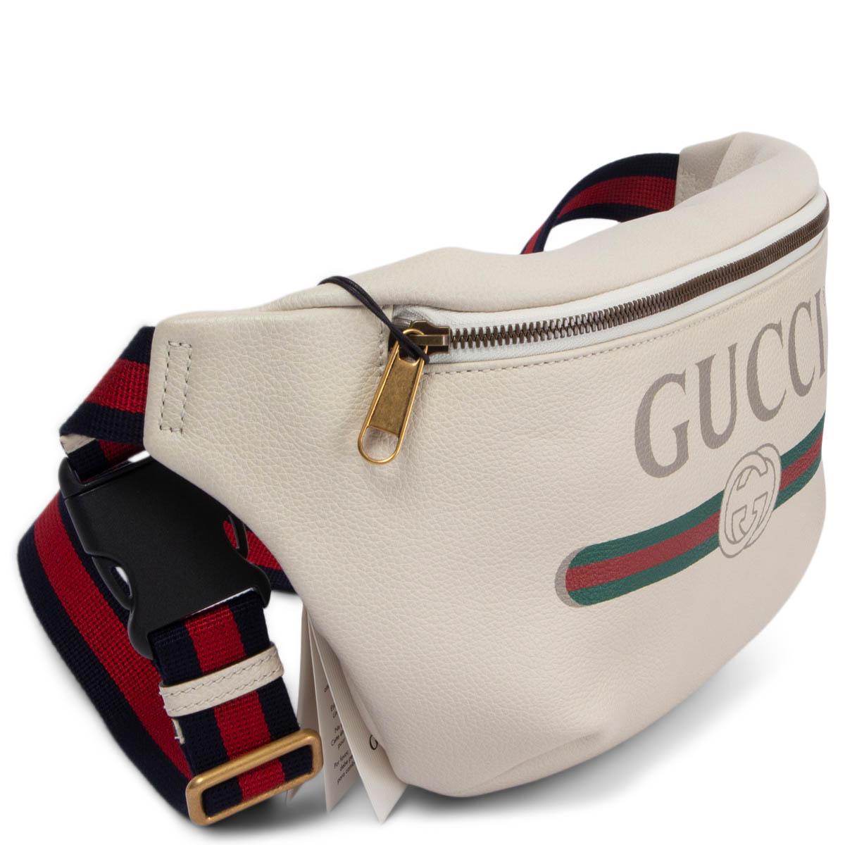 100% authentic Gucci belt bag in ivory leather with oversized logo. Adjustable red and blue web stripe canvas belt strap. Opens with a zipper on top. Lined in off-white canvas. Brand new.

Measurements
Height	18cm (7in)
Width	31cm (12.1in)
Depth	7cm