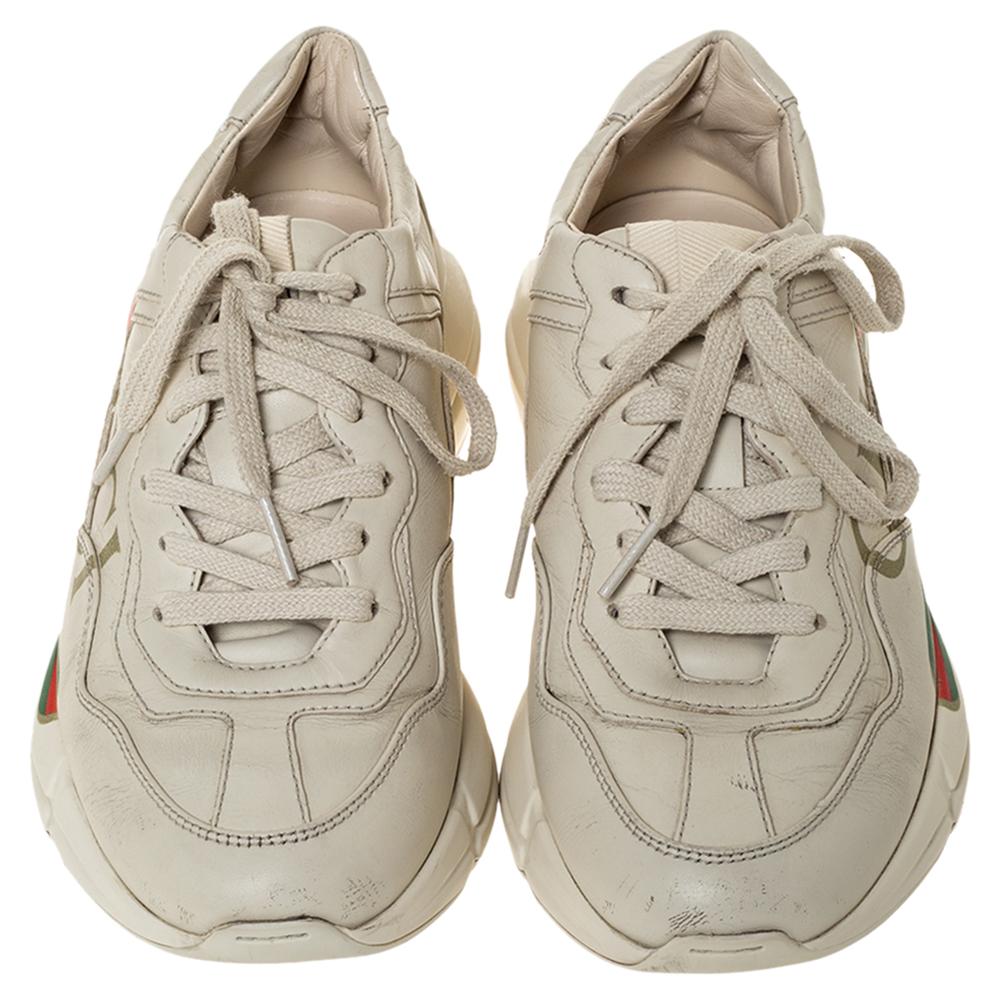The time to feel trendy is now as Gucci brings you these superhit sneakers in ivory. They are crafted from leather, detailed with lace-ups and signature brand accents and are set on highly comfortable platforms. You are sure to receive nods of