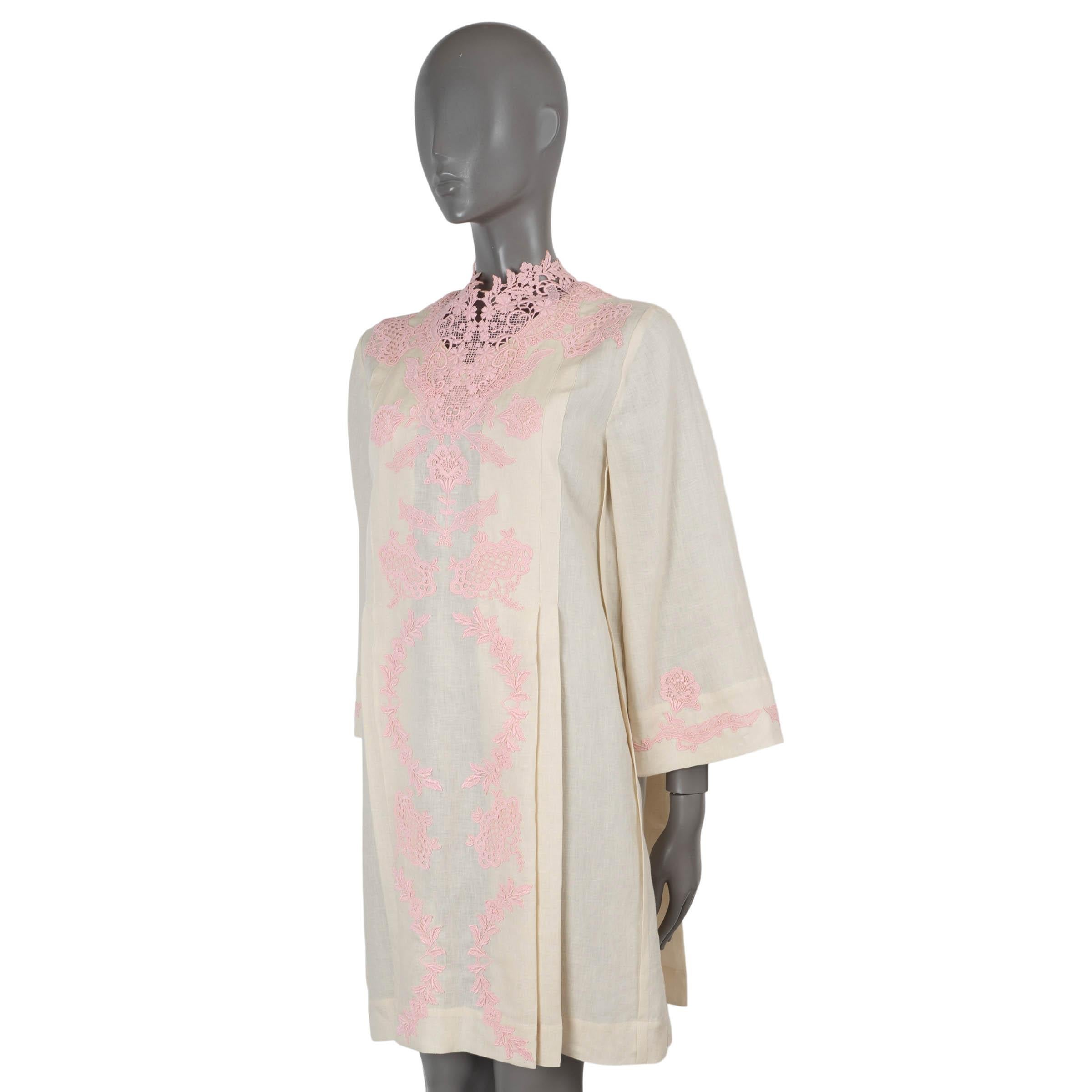 100% authentic Gucci kaftan dress in ivory linen (100%) with pink floral lace trim. Features a relaxed silhouette with pleats on the front and back, mock neck and wide sleeves. Opens with a concealed zipper in the back. Unlined. Has been worn and is