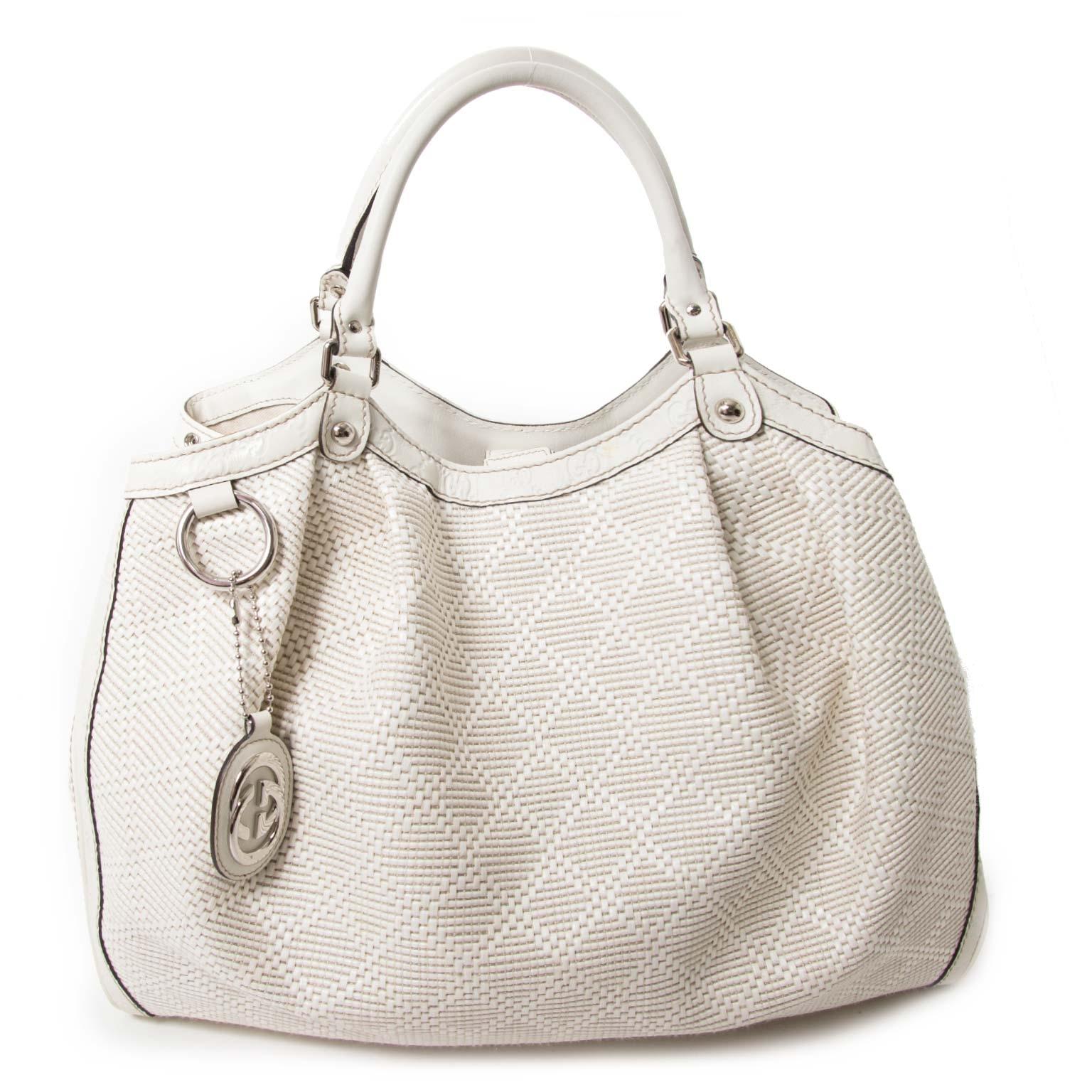 Good preloved condition

Gucci Ivory Straw 'Sukey' Bag

This timeless and elegant tote by Gucci has a refined design, but is very practical at the same time.
It is crafted from woven straw leather with leather edges, completed with GG monogram.
The