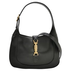 Bolso Gucci Jackie 1961 de cuero negro, pequeño, con cierre de pistón dorado