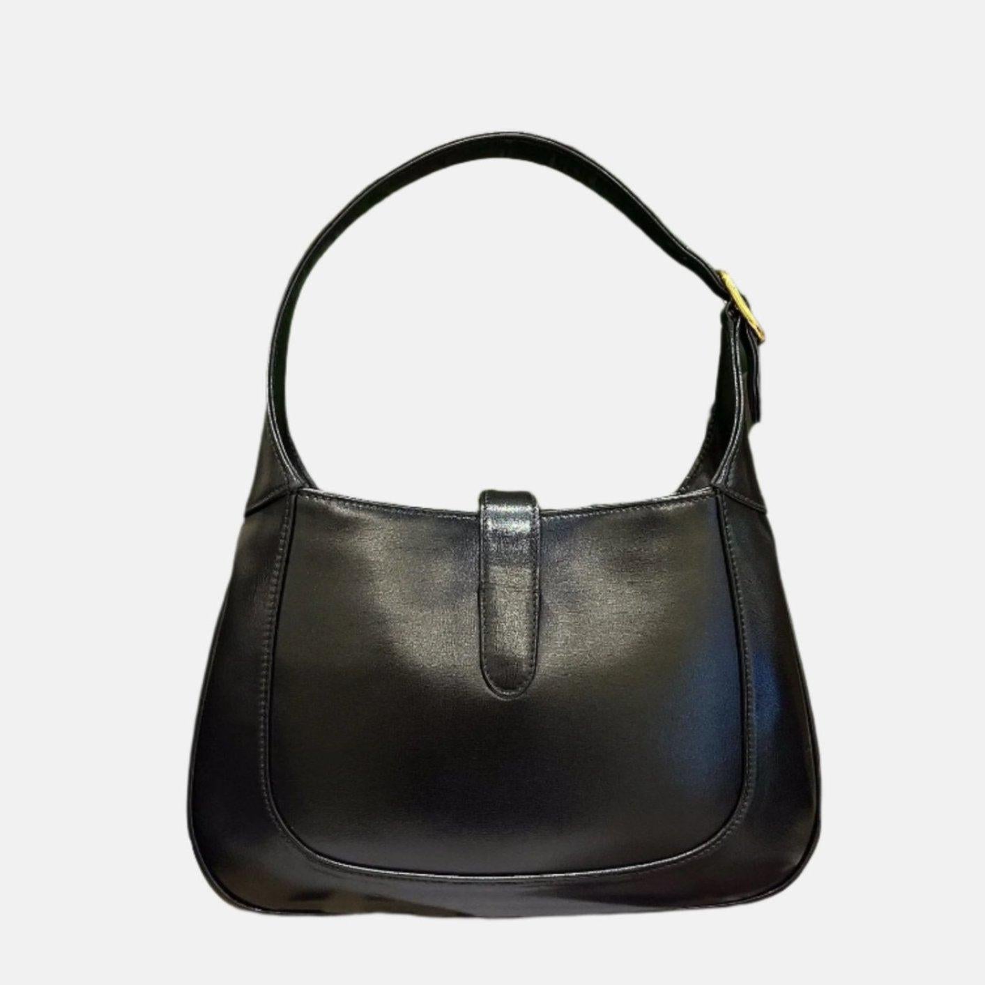 Gucci Jackie 1961 Black Leather Bag Small Piston Lock
 These are professional photos of the actual bag offered by Luxbags.
 The Gucci Jackie 1961 Handbag is a modern take on an iconic design. Crafted in leather with a structured silhouette, it