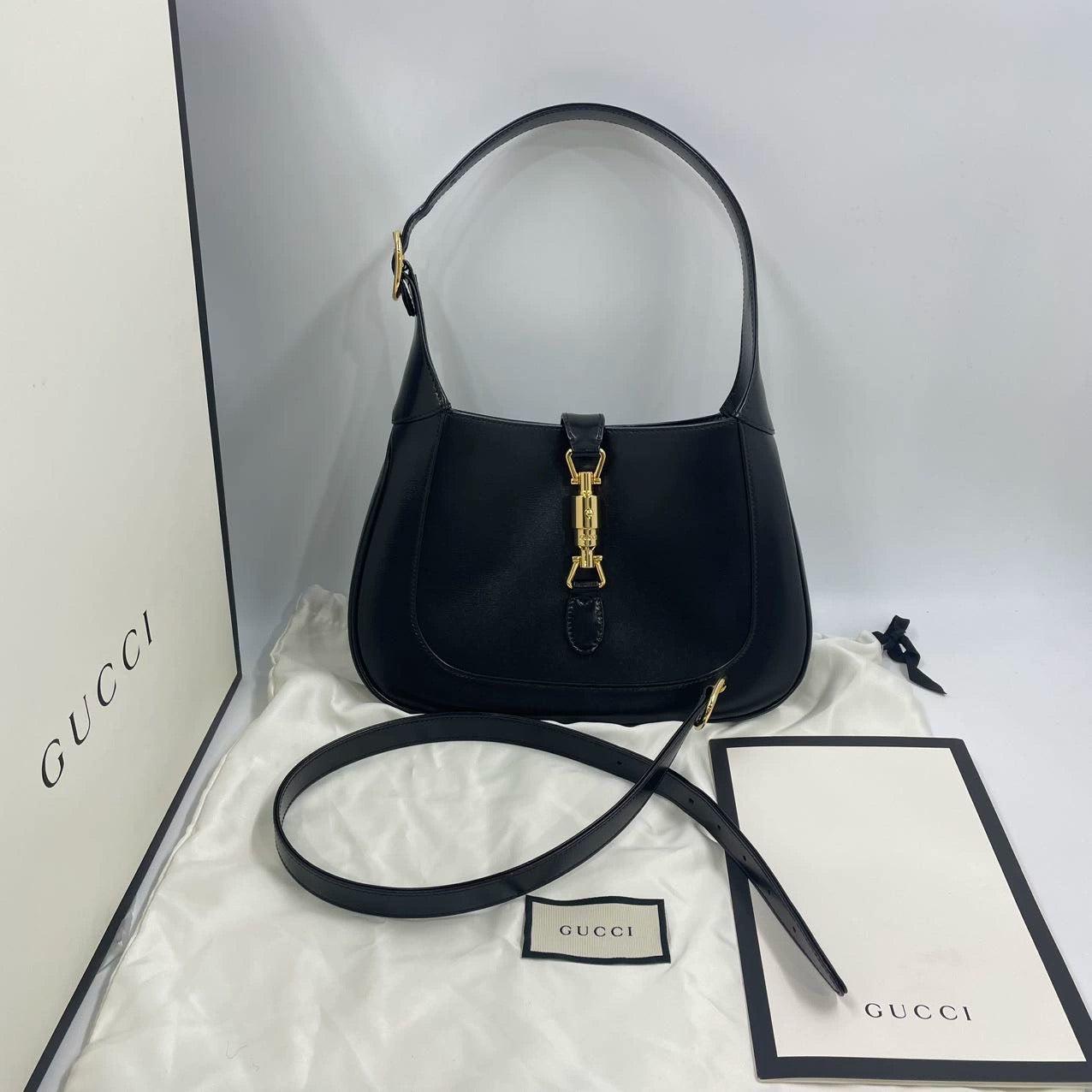 Gucci Jackie 1961 Black Leather Bag Small Piston Lock With Strap
 These are professional photos of the actual bag.
 The Gucci Jackie 1961 Handbag is a modern take on an iconic design. Crafted in leather with a structured silhouette, it features a