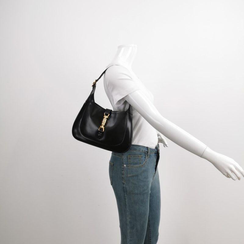 Gucci Jackie 1961 Black Leather Bag Small Piston Lock without Strap
 These are professional photos of the actual bag offered by Luxbags.
 The Gucci Jackie 1961 Handbag is a modern take on an iconic design. Crafted in leather with a structured
