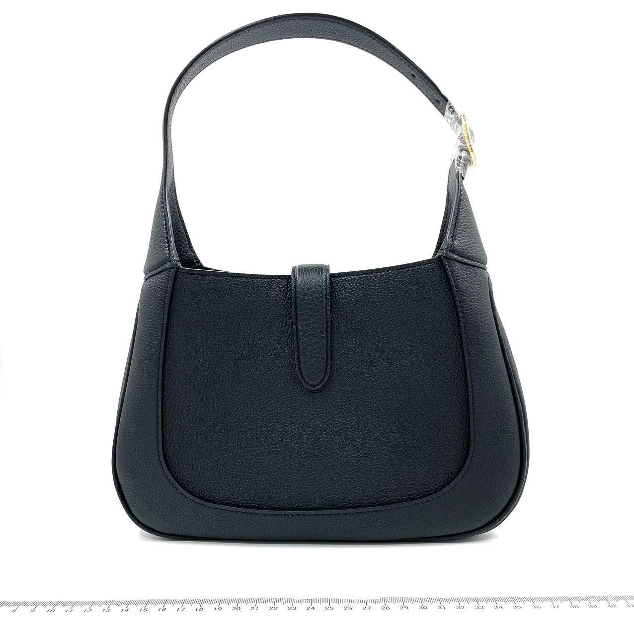 Gucci Jackie 1961 Black Pebbled Leather Bag Small
  These are professional photos of the actual bag.
  
  The Gucci Jackie 1961 Black Small bag is a modern take on an iconic design. Crafted in soft pebbled leather with a structured silhouette, this