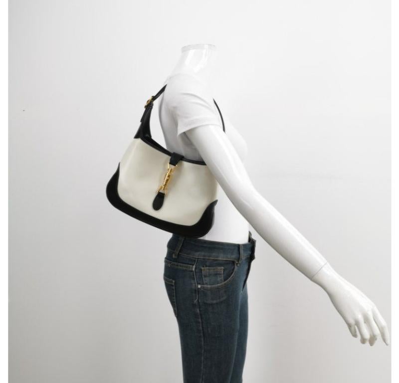 Gucci Jackie 1961 Black & White Leather Bag Small
These are professional photos of the actual bag.
  The Gucci Jackie 1961 Handbag is a modern take on an iconic design. Crafted in black and white leather with a structured silhouette, it features a