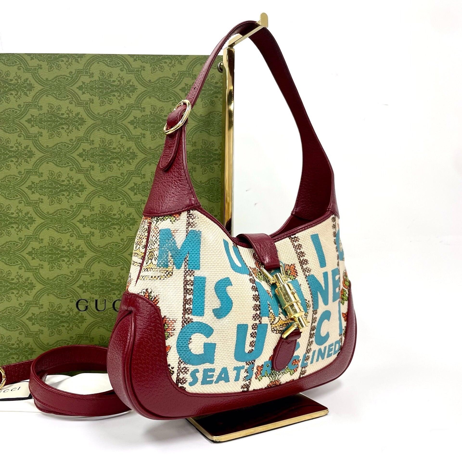 Gucci Jackie 1961 Centennial 100 Year Special Edition Burgundy Leather with Canvas
 These are professional photos of the actual bag offered by Luxbags.
 
 This Gucci Jackie 1961 is a Gucci Centennial Special Edition issue. It features top adjustable