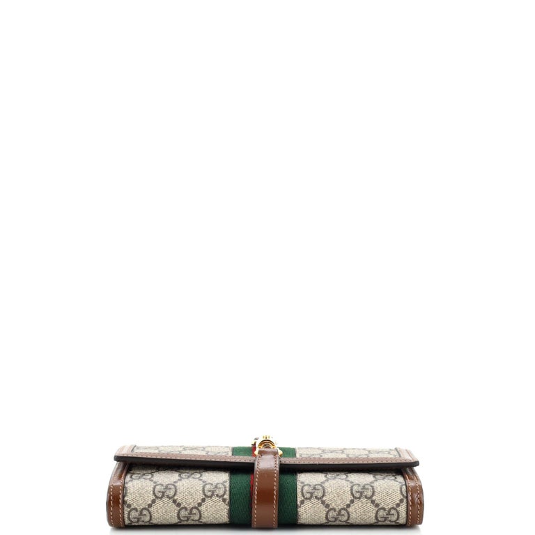 At Auction: Gucci Coated Canvas Long Wallet