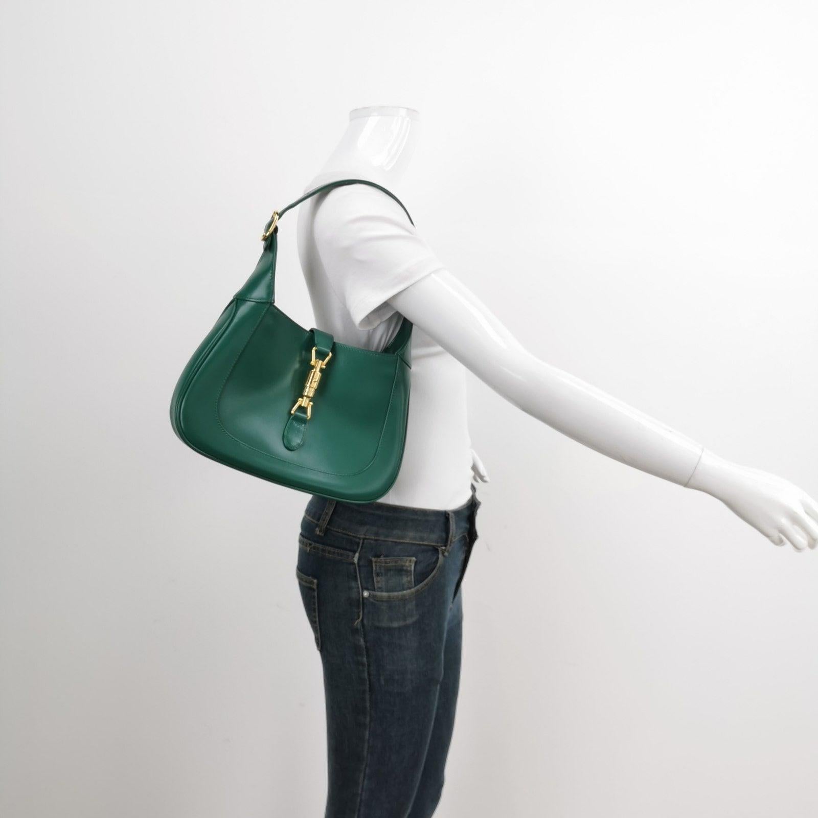 Gucci Jackie 1961 Green Leather Bag Small with Adjustable Strap
These are professional photos of the actual bag.
  The Gucci Jackie 1961 Green Small bag is a modern take on an iconic design. Crafted in leather with a structured silhouette, it