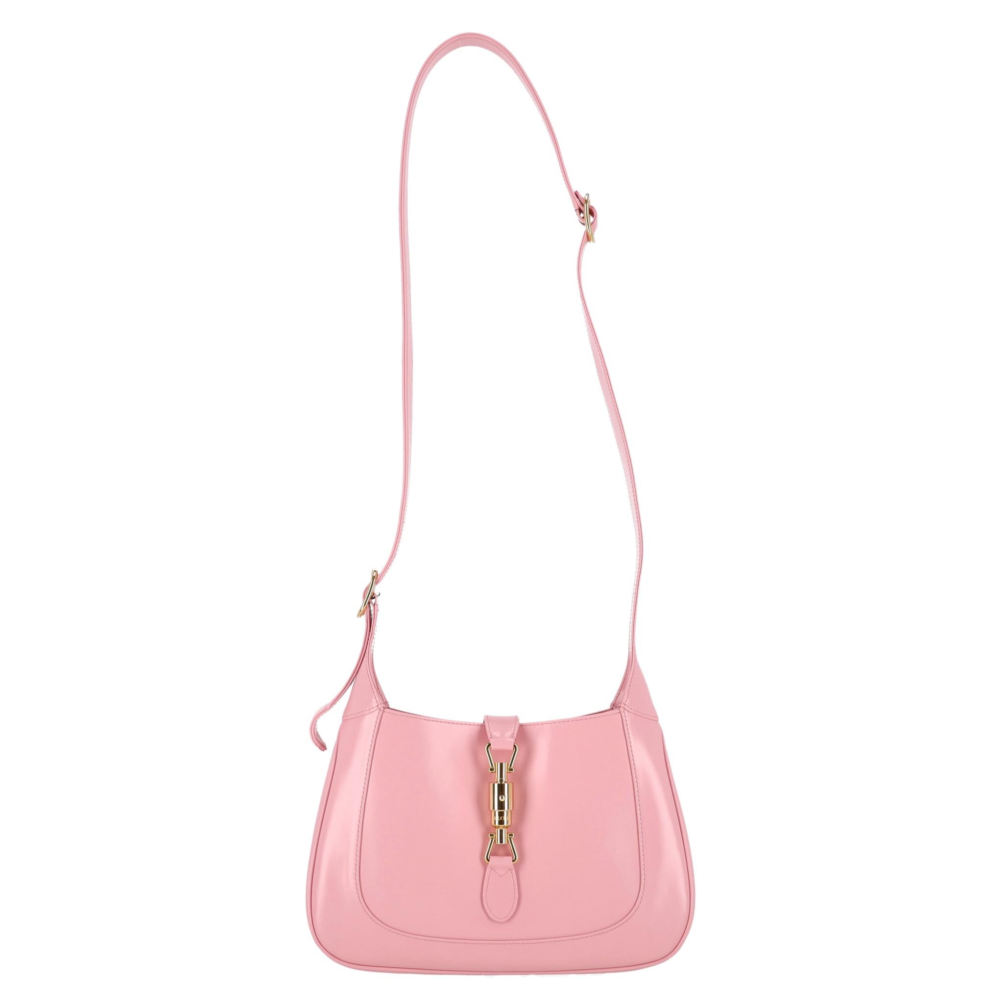 Gucci Jackie 1961 Leather Medium Bag

The brand's signature design - Jackie bag in baby pink leather.

Featuring light gold 'Gucci' engraved piston closure and two, adjustable shoulder straps.

Open top leading to nude interior having zip pocket