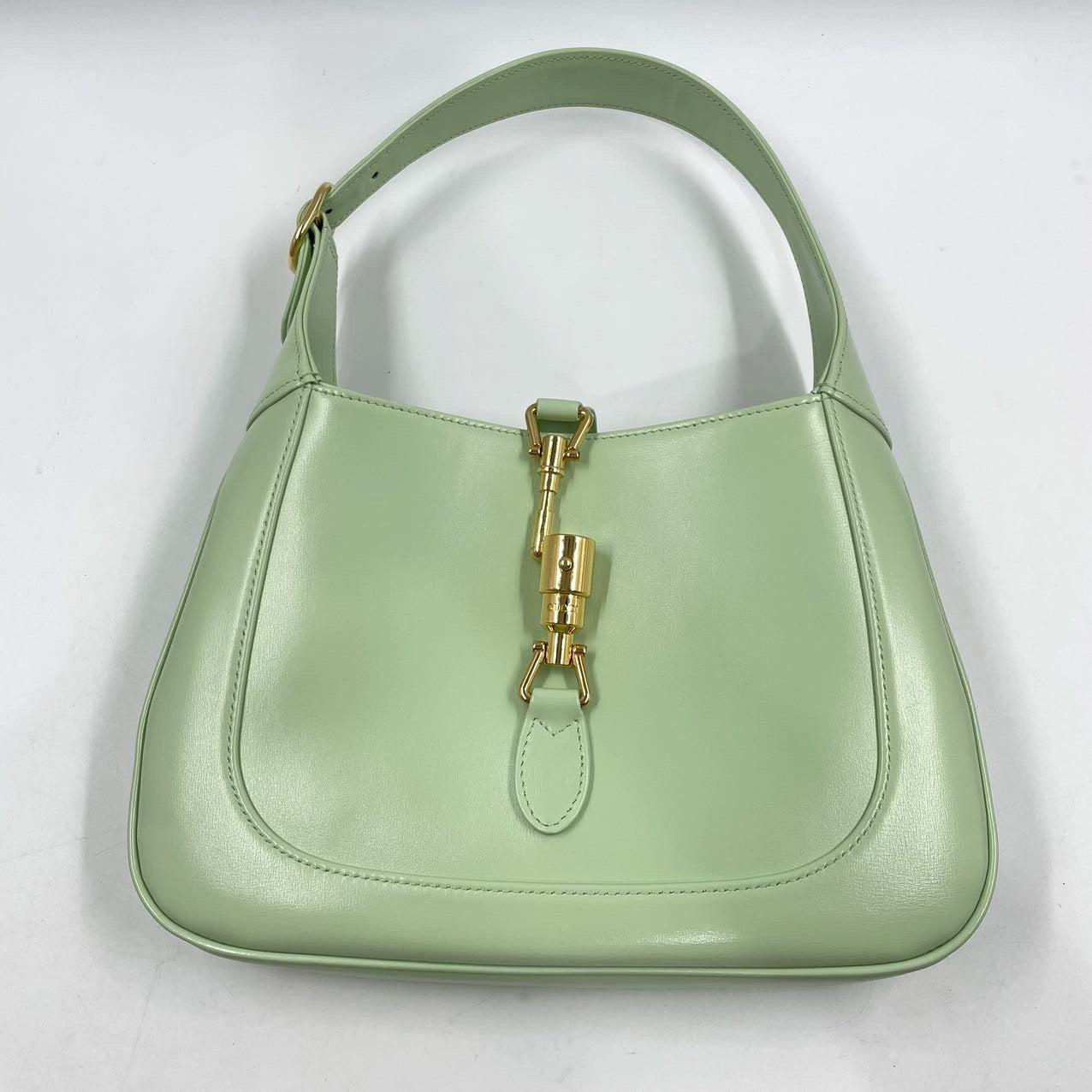 Gucci Jackie 1961 Light Green Leather Bag Small with Adjustable Strap
These are professional photos of the actual bag.
  The Gucci Jackie 1961 Green Small bag is a modern take on an iconic design. Crafted in leather with a structured silhouette, it
