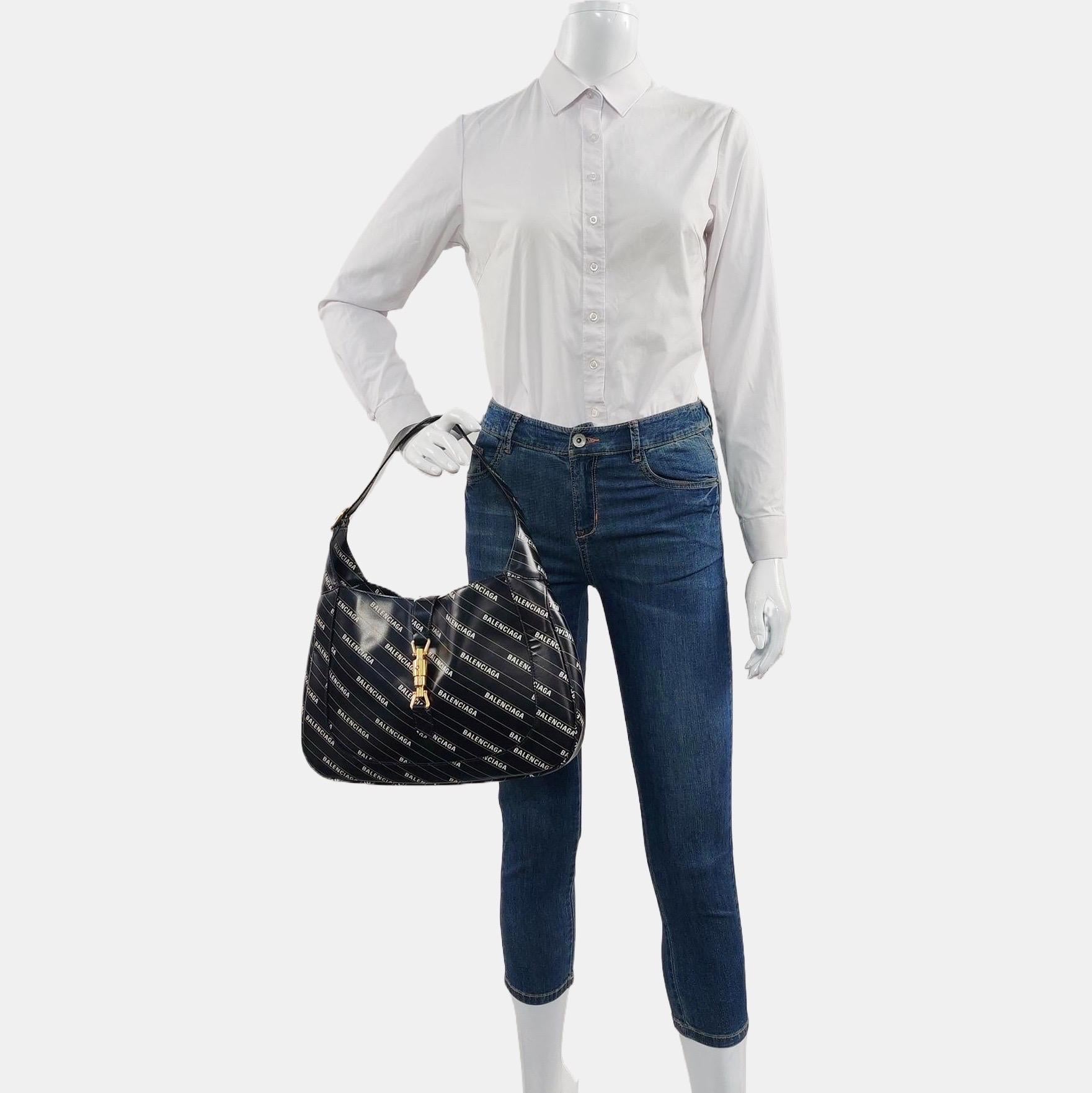 Gucci Jackie 1961 Medium Balenciaga Black Leather Bag with Strap
These are professional photos of the actual bag offered by Luxbags.

The Gucci Jackie 1961 Black bag is a modern take on an iconic design. Crafted in leather with a structured