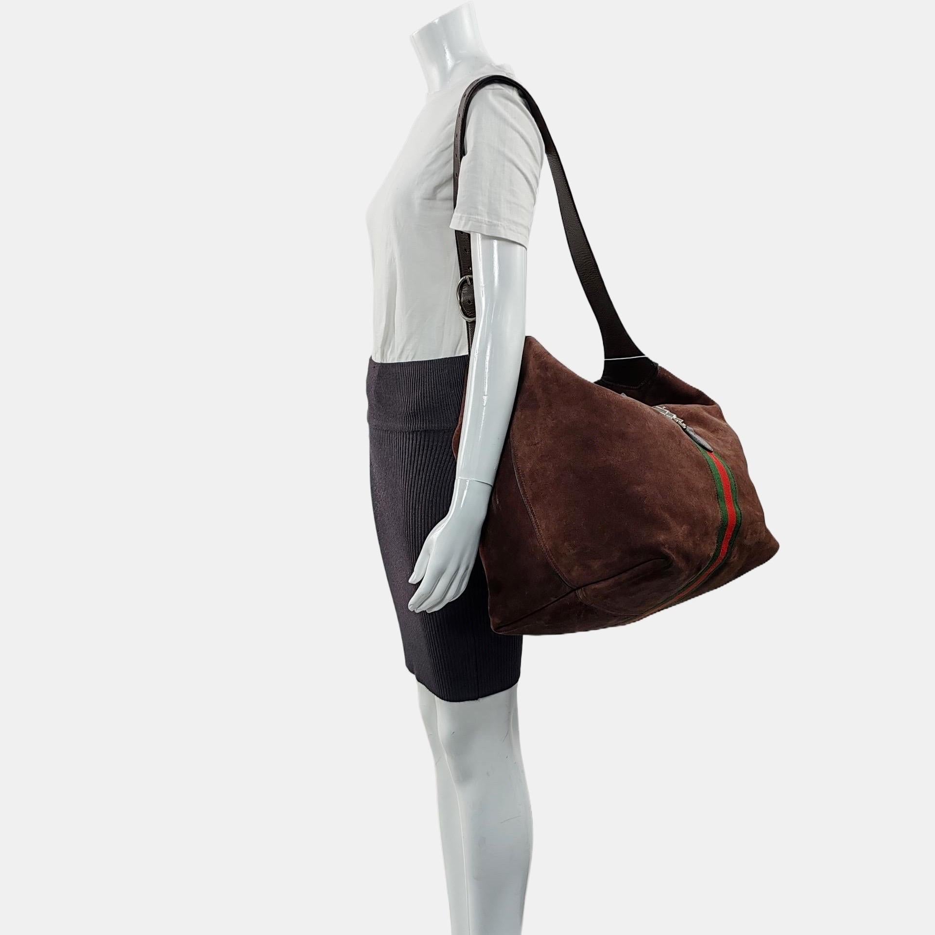 Gucci Jackie 1961 Medium Brown Suede Shoulder Tote Bag
These are professional photos of the actual bag offered by Luxbags.

The Gucci Jackie 1961 Black bag is a modern take on an iconic design. Crafted in leather with a structured silhouette, it