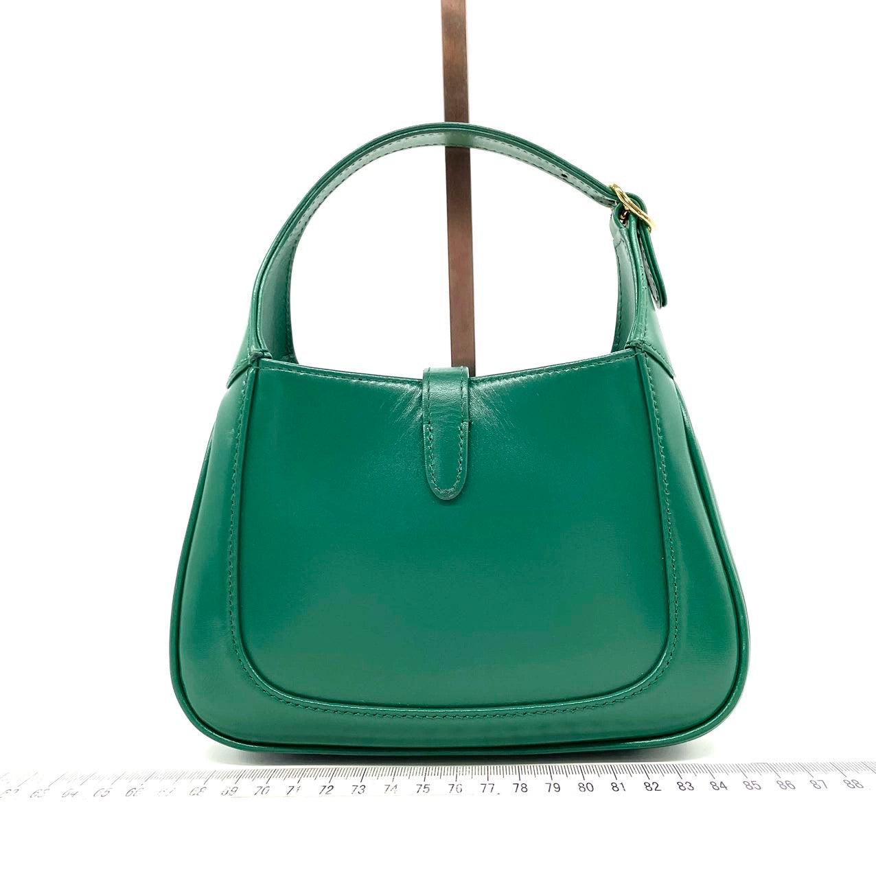Gucci Jackie 1961 Mini Handbag in Green Leather with Adjustable Strap
These are professional photos of the actual bag.
  The Gucci Jackie 1961 Mini Handbag in Green Leather is a contemporary interpretation of a timeless style. Crafted with premium