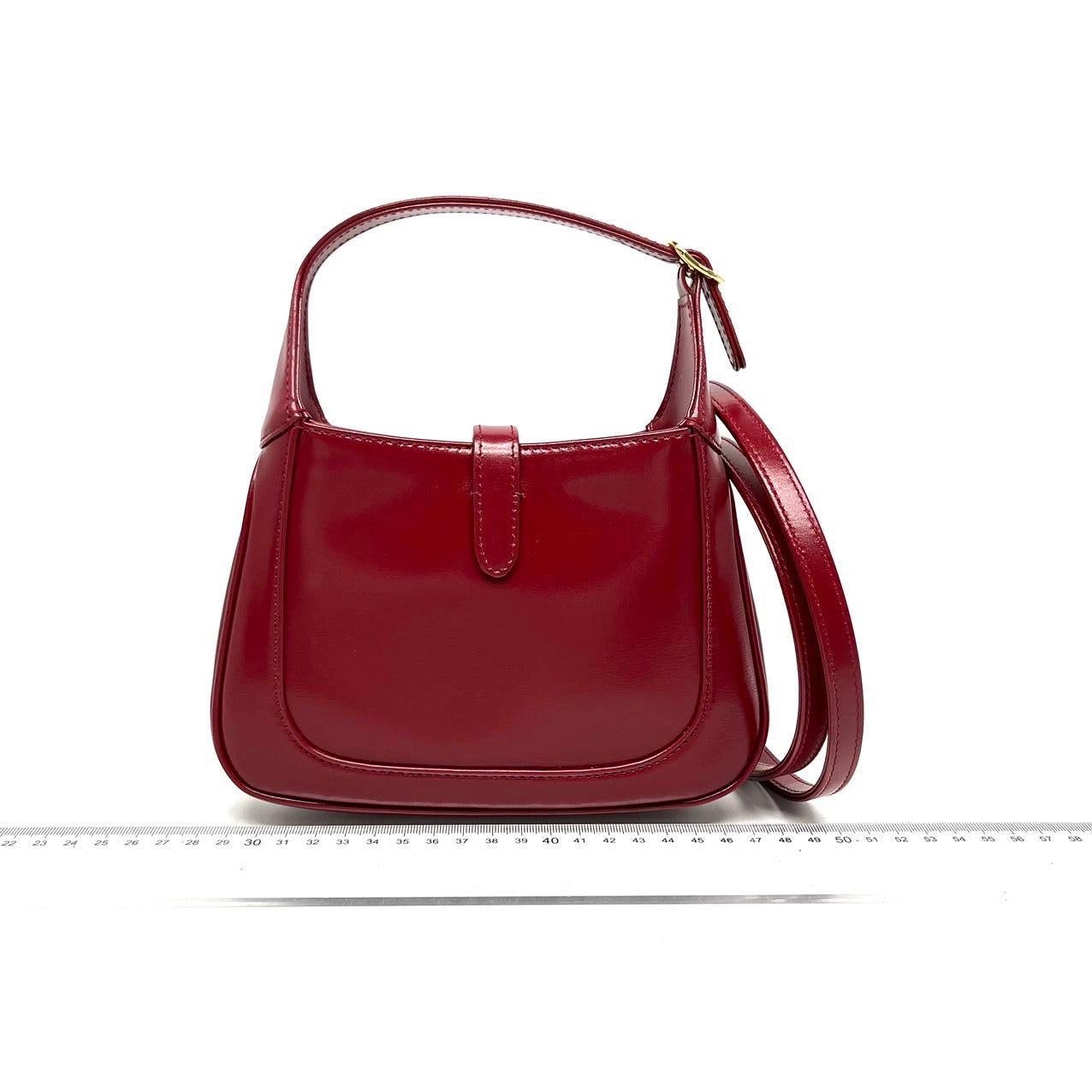 Gucci Jackie 1961 Mini Red Burgundy Leather Bag

  The Gucci Jackie 1961 Burgundy mini bag is a modern take on an iconic design. Crafted in leather with a structured silhouette, it features a crossbody strap so you can bring your essentials wherever