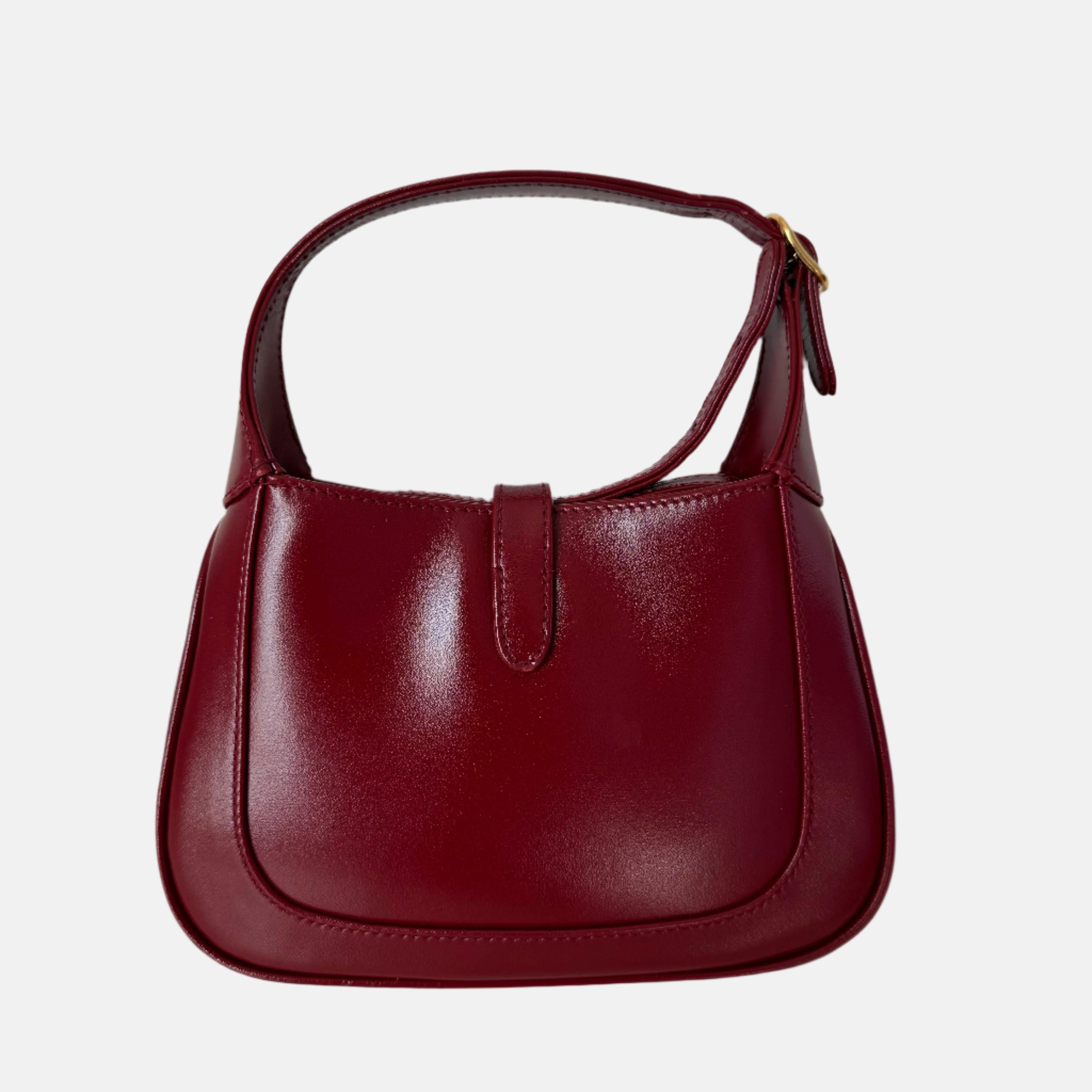 Gucci Jackie 1961 Mini Red Burgundy Leather Bag
 These are professional photos of the actual bag.
 The Gucci Jackie 1961 Burgundy mini bag is a modern take on an iconic design. Crafted in leather with a structured silhouette, it features a crossbody