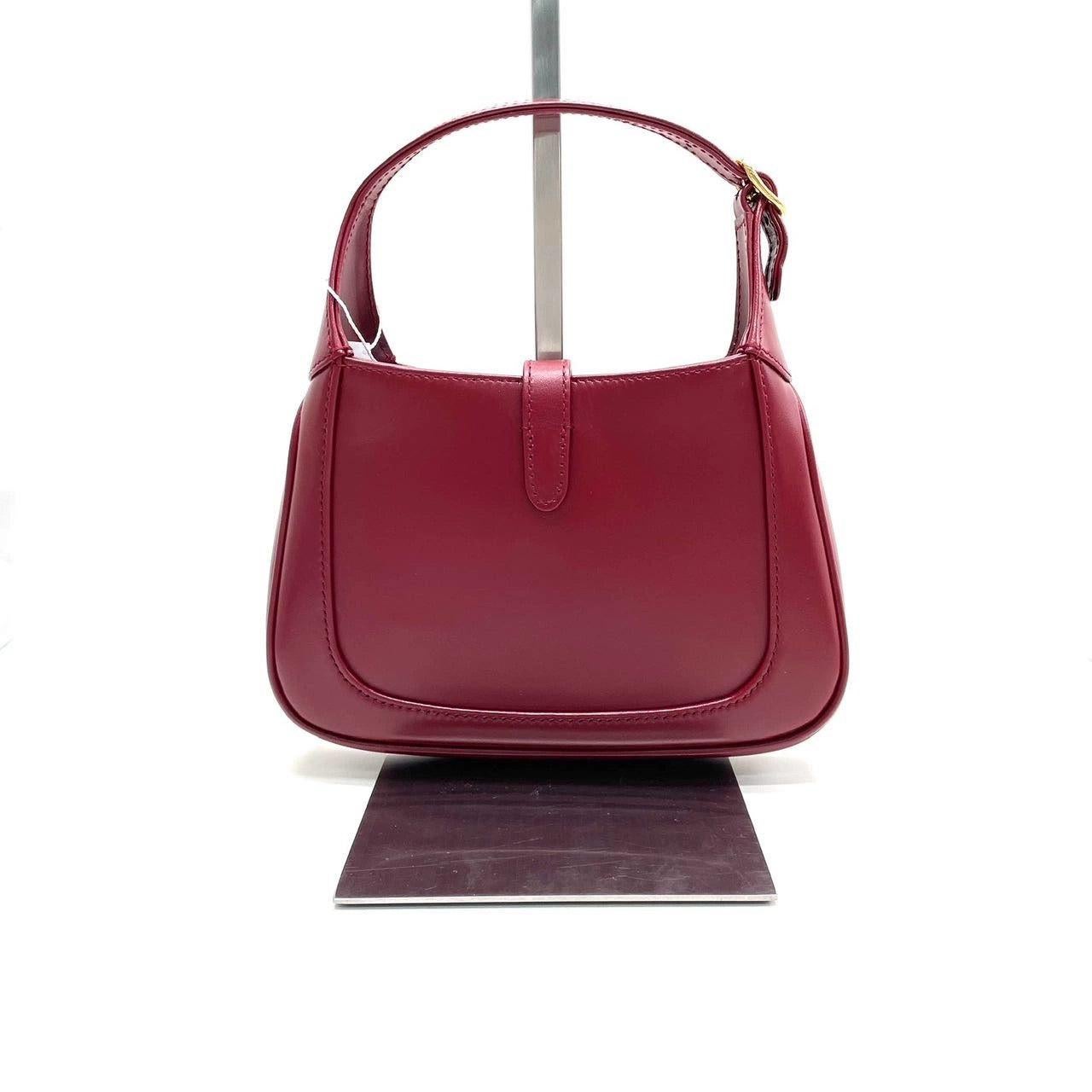 Gucci Jackie 1961 Mini Red Burgundy Leather Bag No Strap
 These are professional photos of the actual bag offered by Luxbags.
 The Gucci Jackie 1961 Burgundy mini bag is a modern take on an iconic design. Crafted in leather with a structured