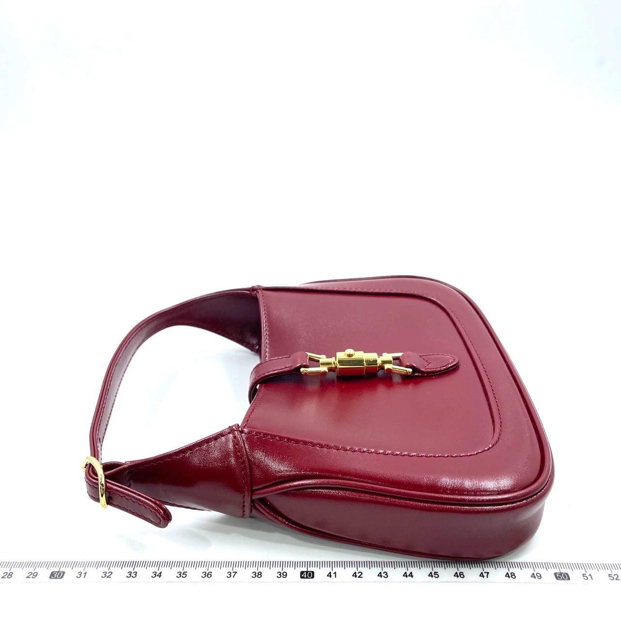 Gucci Jackie 1961 Mini Red Burgundy Leather Bag No Strap
 These are professional photos of the actual bag .
 CONDITION: EXCELLENT 
 MISSING LONG SHOULDER STRAP 
 Brand: Gucci
 
 Model: Jackie 1961
 Exterior Material: Leather
 Exterior Color: