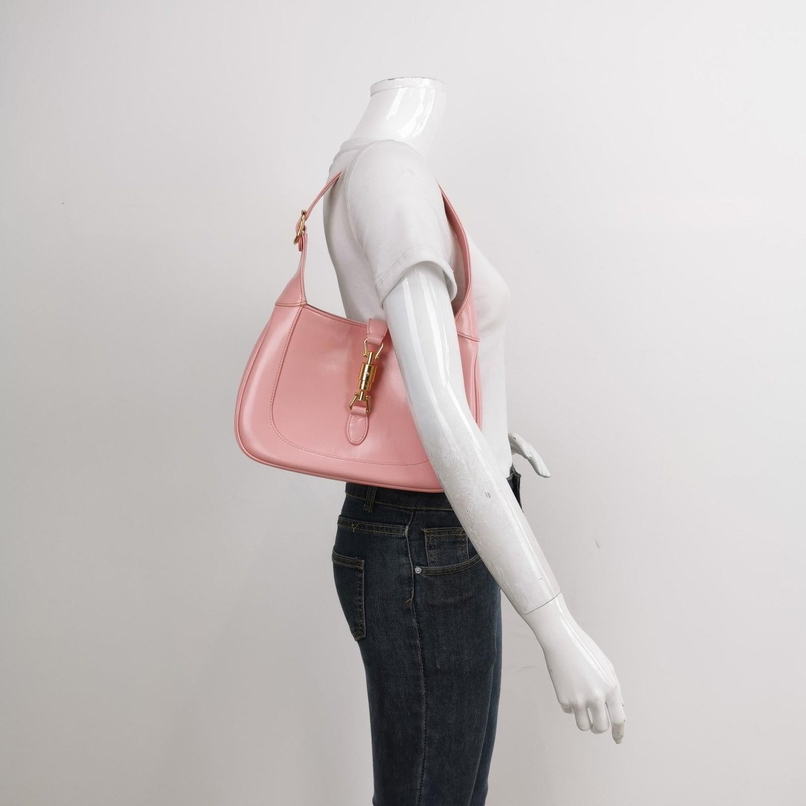 Gucci Jackie 1961 Small Leather Bag with Adjustable Strap Size Pink These are professional photos of the actual bag offered by Luxbags. The Gucci Jackie 1961 White Small bag is a modern take on an iconic design. Crafted in leather with a structured