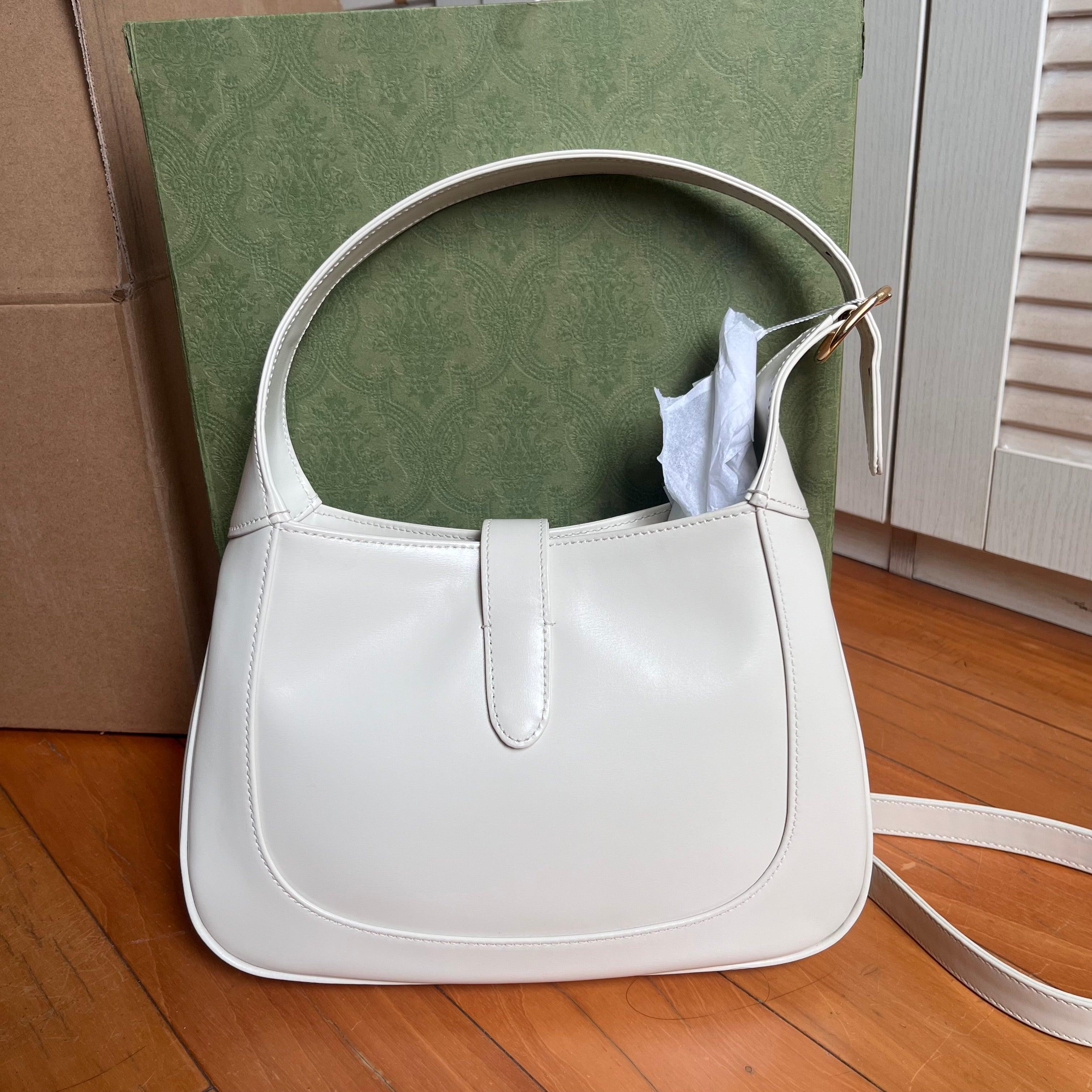 Gucci Jackie 1961 Small Leather Bag with Adjustable Strap White
These are professional photos of the actual bag.
  The Gucci Jackie 1961 White Small bag is a modern take on an iconic design. Crafted in leather with a structured silhouette, it