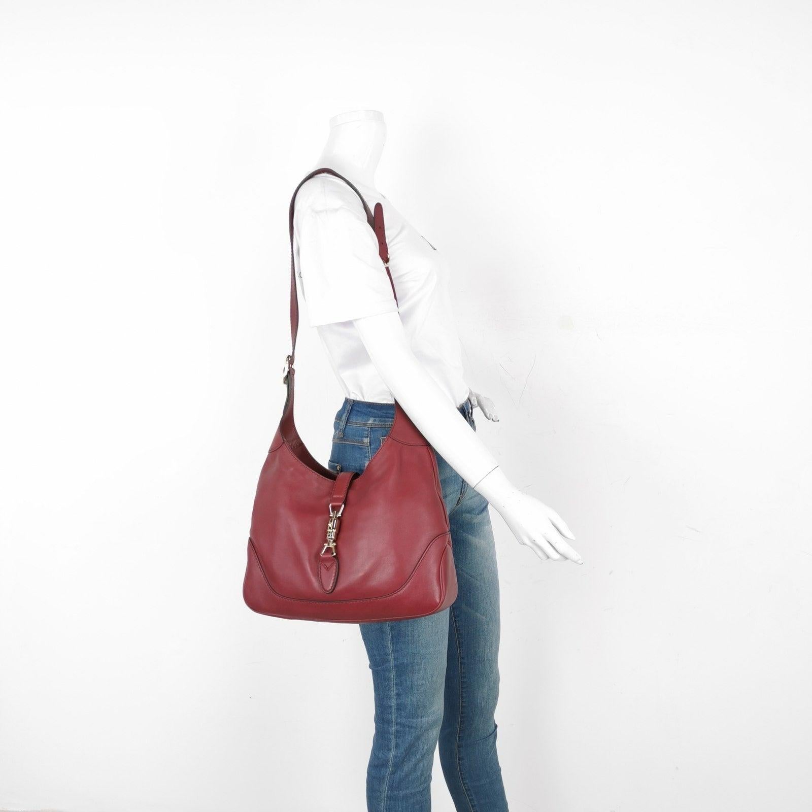 Gucci Jackie 1961 Soft Medium Leather Bag Burgundy Red These are professional photos of the actual bag offered by Luxbags. CONDITION Very good condition with moderate sense of use throughout. Minor scrapes at the leather trim, bottom. Light hardware