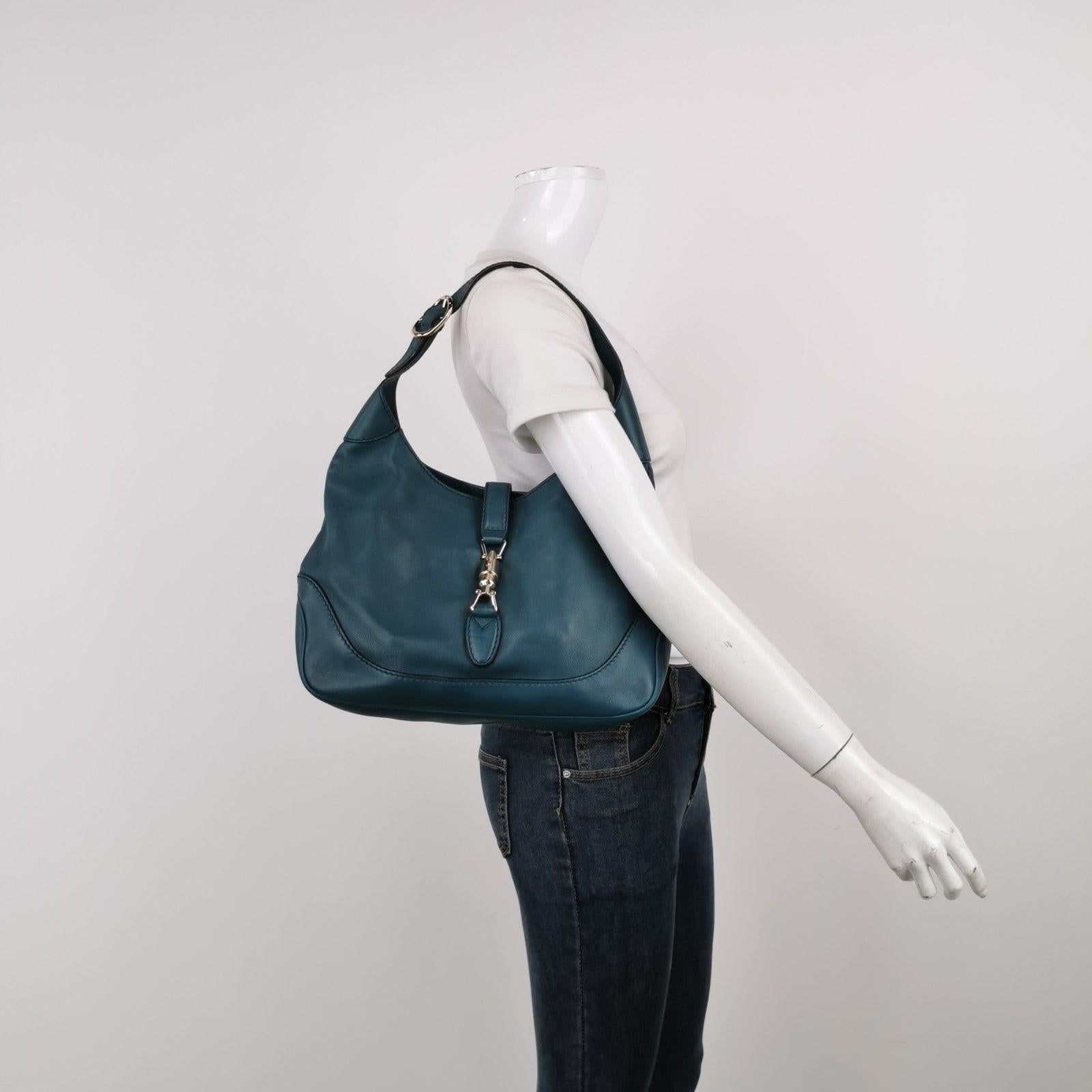 Gucci Jackie 1961 Soft Navy Leather Bag Medium These are professional photos of the actual bag offered by Luxbags. CONDITION Excellent condition with light sense of use throughout. Minor scrapes at the leather trim, bottom. Light hardware discolor.