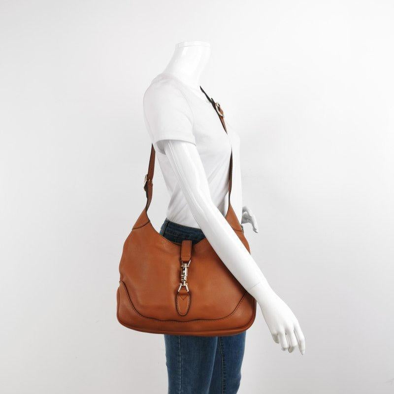 Gucci Jackie 1961 Soft Tan Brown Leather Bag Medium
 These are professional photos of the actual bag offered by Luxbags.
 CONDITION: VERY GOOD
 
 Very good condition with light sense of use throughout. Minor scrapes at the leather trim, bottom.