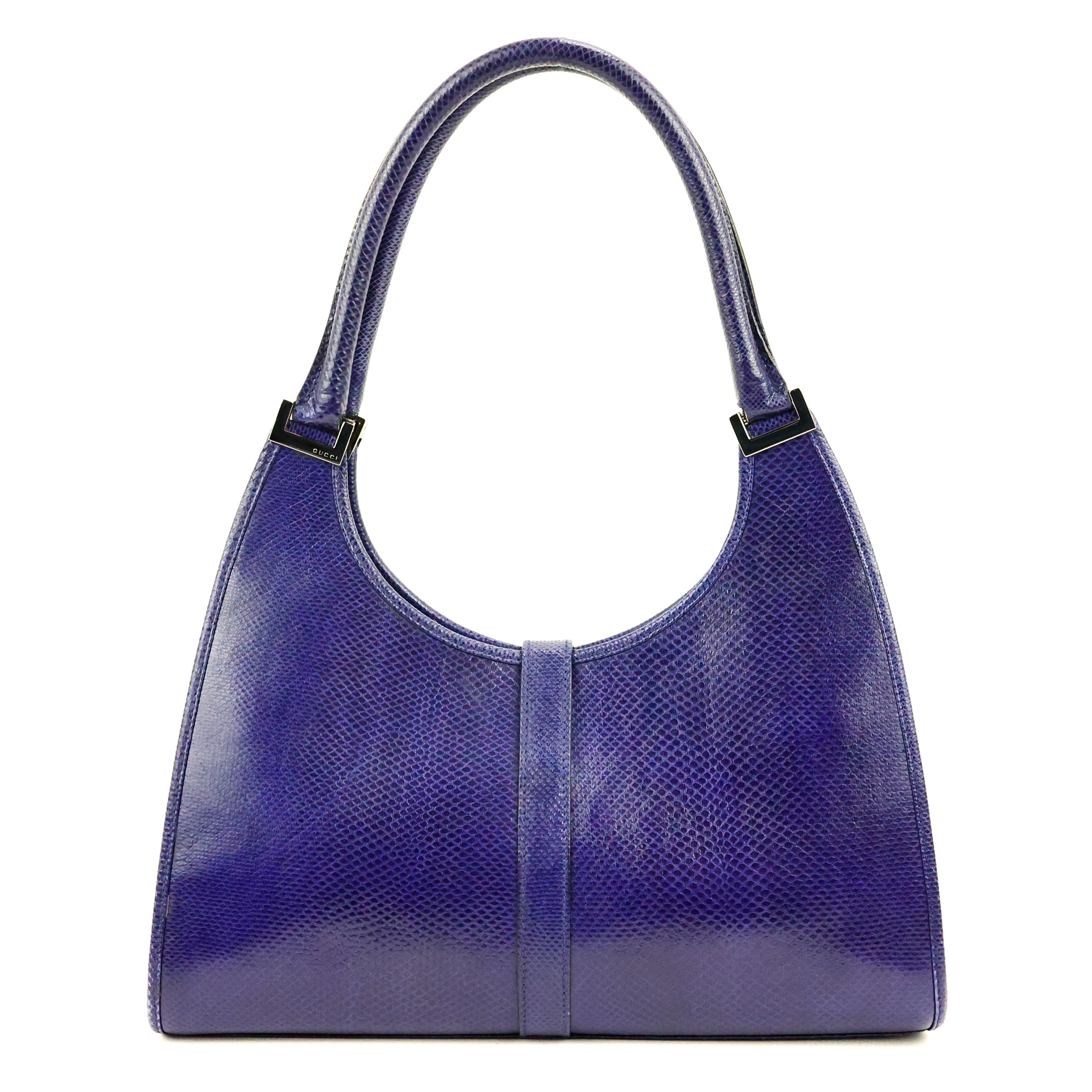 Gucci Jackie / Bardort bag in purple lizard leather, silver hardware.

Condition:
Really good.

Packing/accessories:
Dustbag, card.

Measurements:
31cm x 16cm x 11cm
