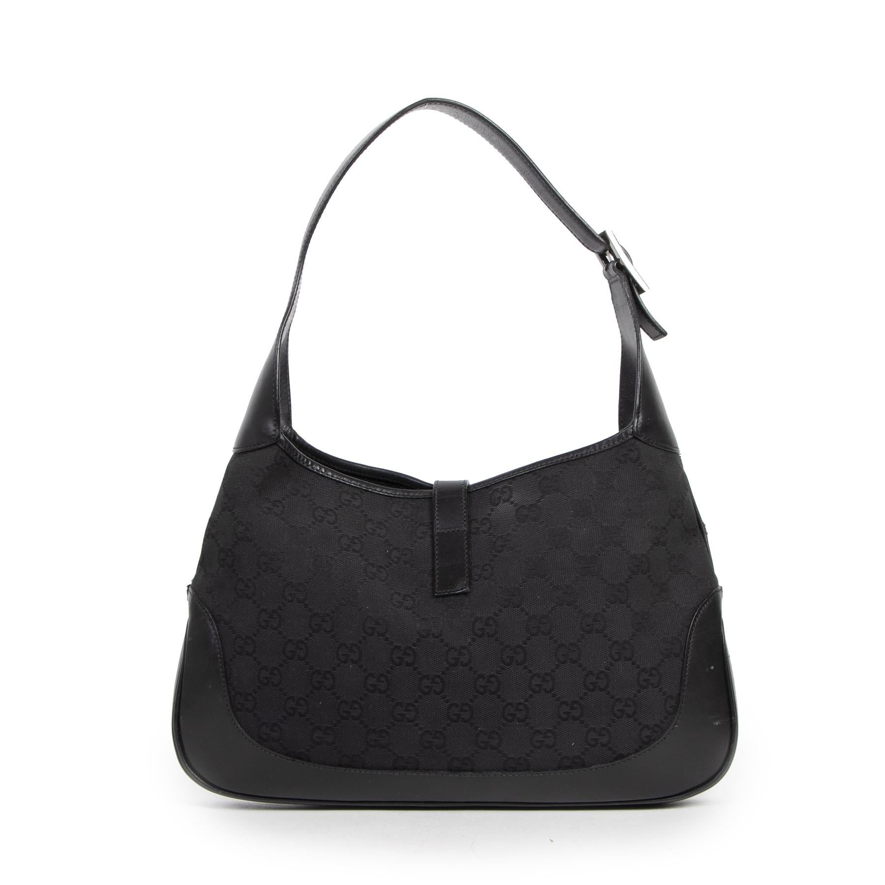 Good preloved condition

Gucci Jackie Black GG Monogram Canvas Leather Shoulder Bag 

This gorgeous Gucci shoulder bag was designed in 1958 as an hommage to Jackie Kennedy. The bag is crafted in the iconic GG monogram in black canvas and features