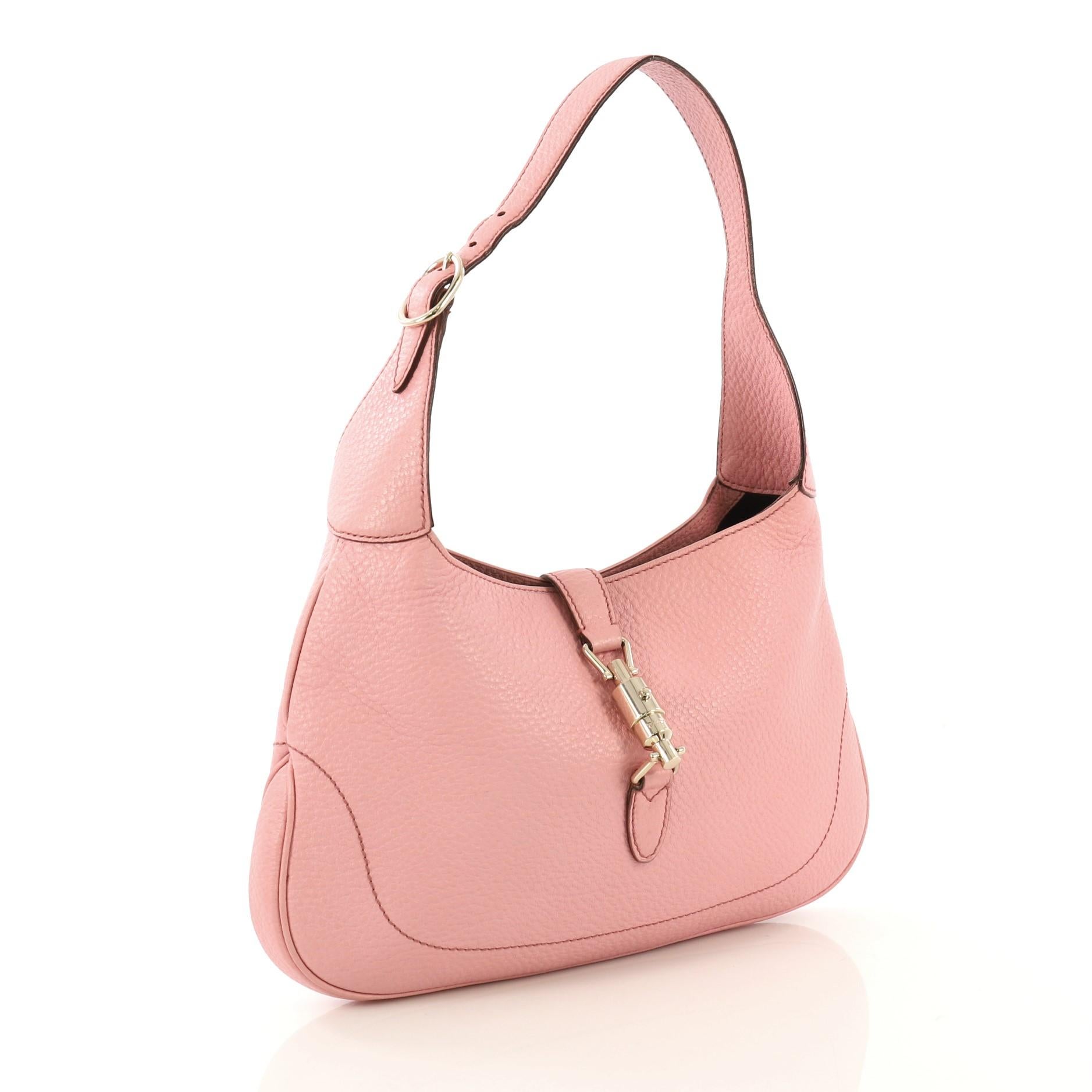 This Gucci Jackie O Bouvier Hobo Leather Medium, crafted from pink leather, features an adjustable shoulder leather strap and gold-tone hardware. Its piston-strap closure opens to a black leather interior with side zip pocket. 

Estimated Retail