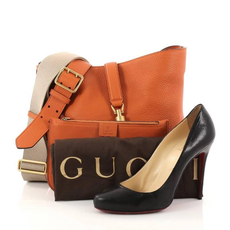 This authentic Gucci Jackie Soft Bucket Bag Leather is a must-have luxurious everyday bag fit for the modern woman. Constructed from orange leather, this fresh take on the classic Jackie bag features protective base tabs and aged gold-tone hardware