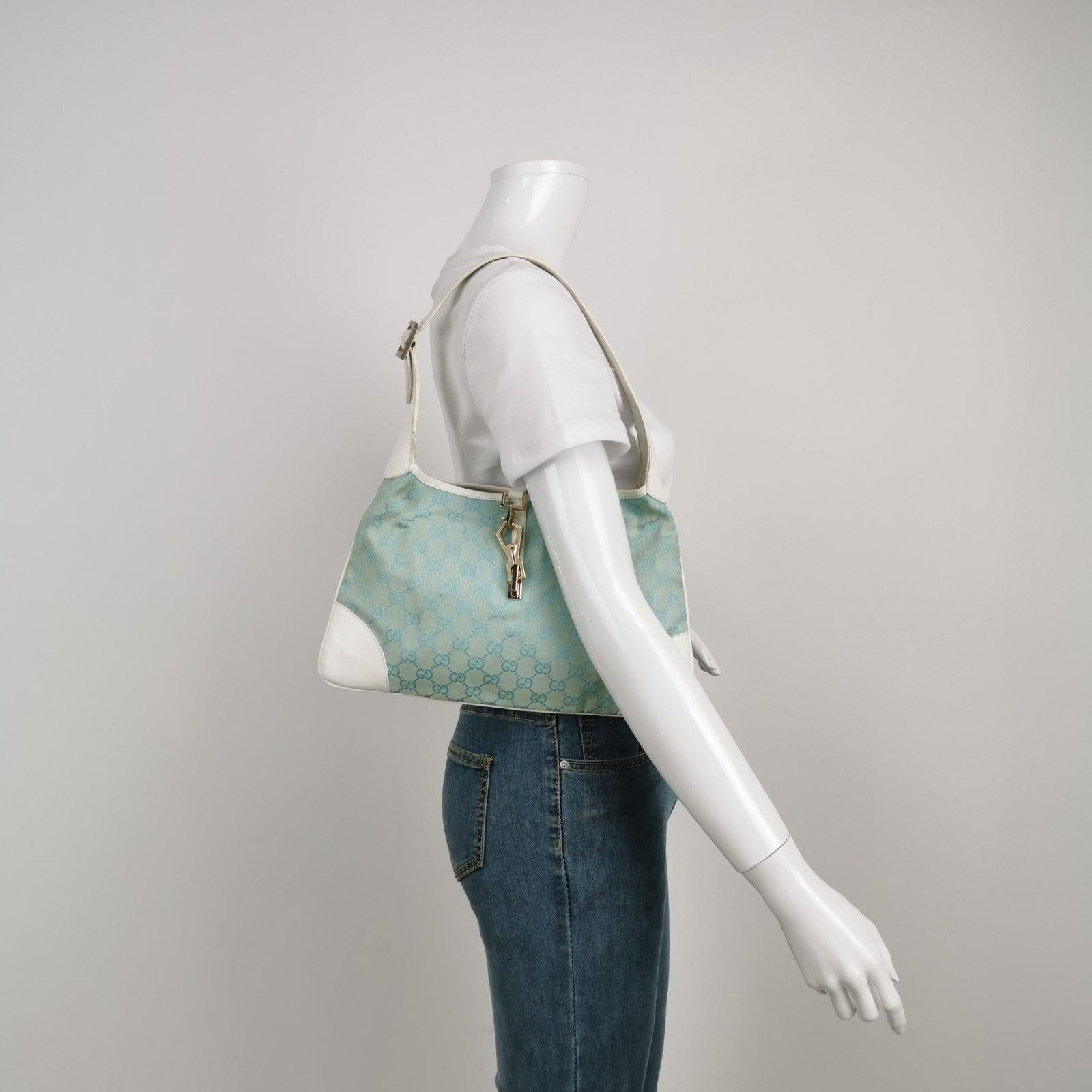 Gucci Jackie Vintage Blue Nylon White Leather Shoulder Bag Medium These are professional photos of the actual bag offered by Luxbags. Brand: GucciModel: Jackie VintageExterior Material: Nylon and leatherExterior Color: Blue and whiteHardware Color: