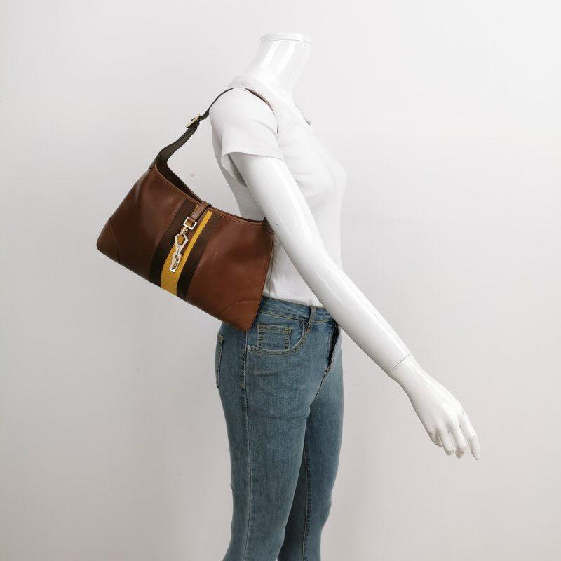 Gucci Jackie Vintage Medium Brown Leather Silver Hardware
 These are professional photos of the actual bag offered by Luxbags.
 CONDITION: VERY GOOD 
 This preloved Gucci item is in very good condition with light signs of wear on the corners and