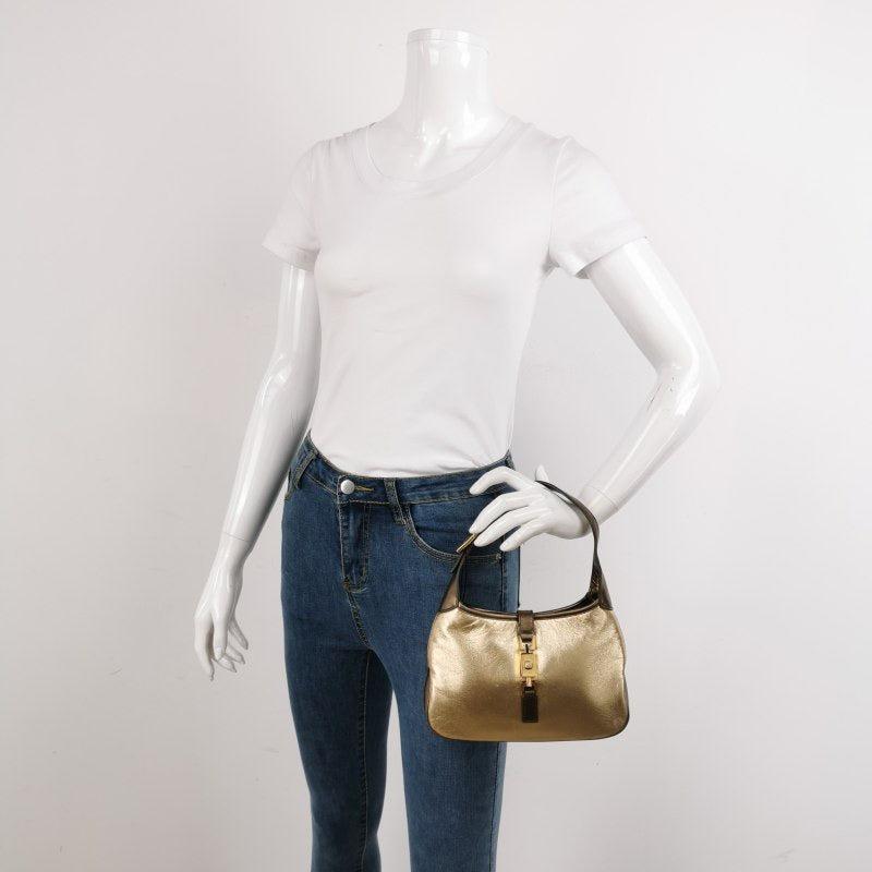 Gucci Jackie Vintage Mini Gold Lambskin Leather Brown Calfskin Leather
 These are professional photos of the actual bag.
 This Gucci Jackie vintage comes in rare mini size crafted from shimmering gold lambskin leather, and metallic brown calfskin