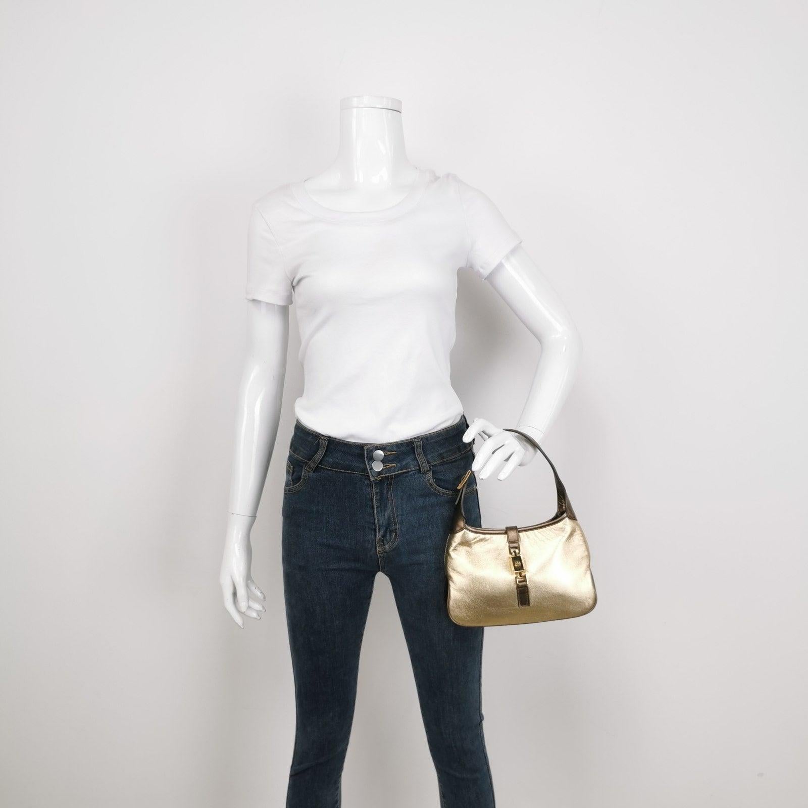 Gucci Jackie Vintage Mini Gold Lambskin Leather Brown Calfskin Leather
  These are professional photos of the actual bag.
  This Gucci Jackie vintage comes in rare mini size crafted from shimmering gold lambskin leather, and metallic brown calfskin