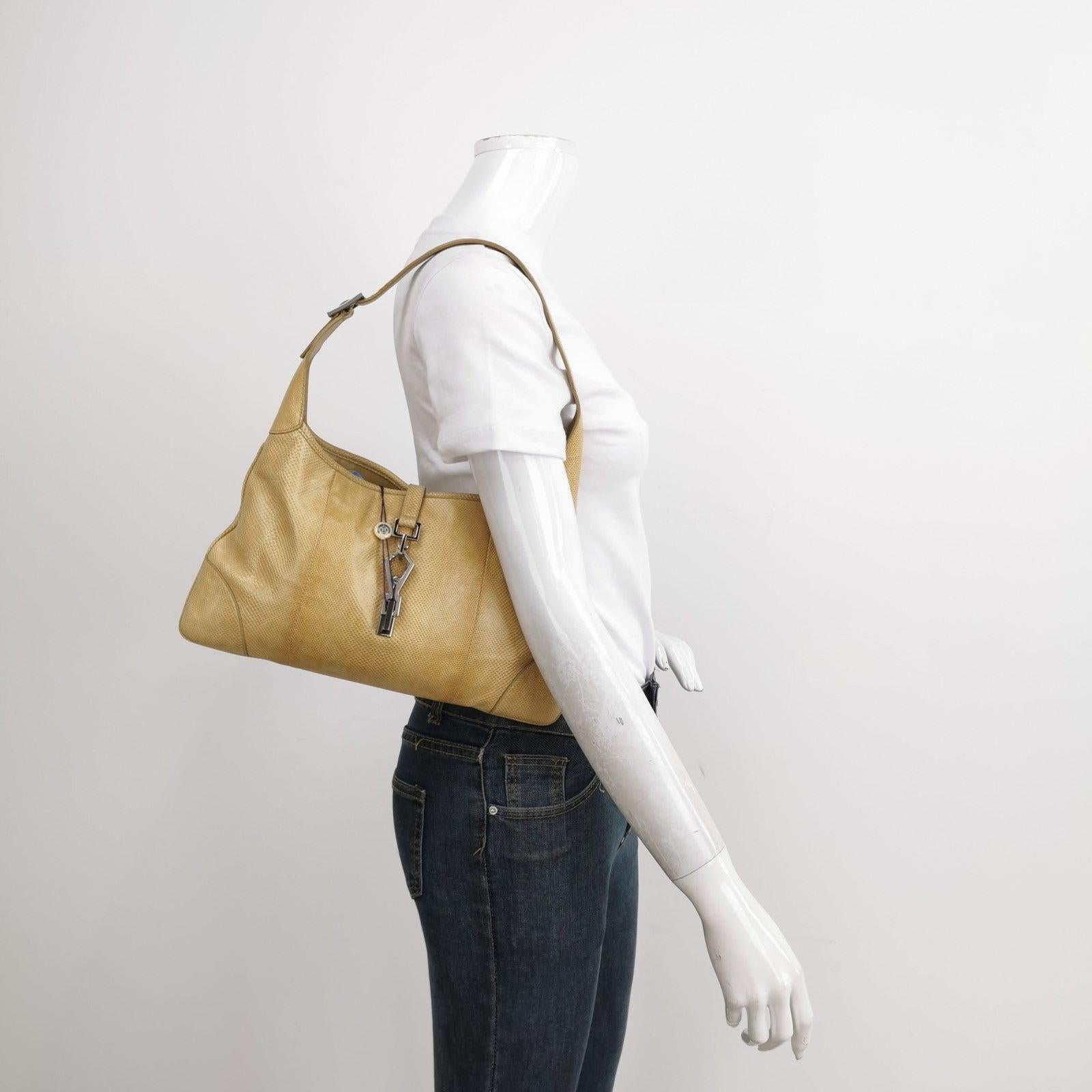 Gucci Jackie Vintage Yellow Gold Exotic Lizard-skin Leather Shoulder Bag
  These are professional photos of the actual bag.
  CONDITION: VERY GOOD 
  This preloved Gucci item is in very good condition with moderate signs of wear on the corners and