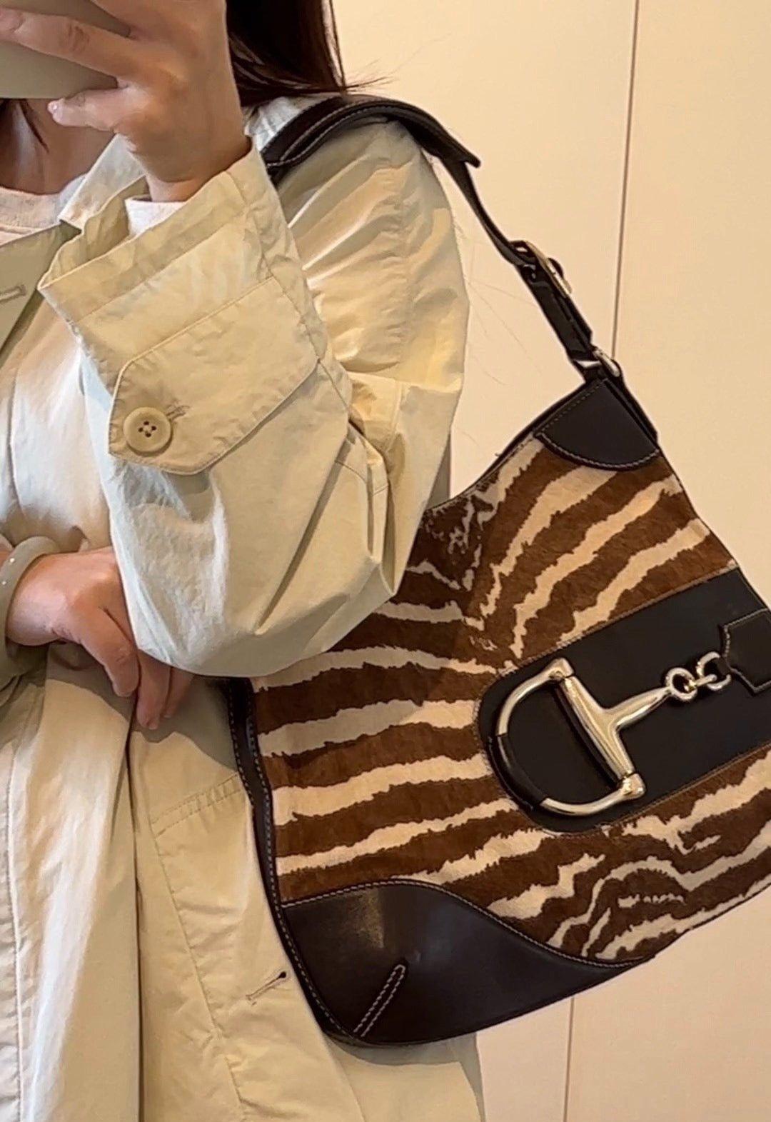 Gucci Jackie Vintage Zebra Print Pony-style Calfskin Side Horsebit
 These are professional photos of the actual bag.
 CONDITION: VERY GOOD 
 This preloved Gucci item is in very good condition with light stains. light scratches on the hardware and