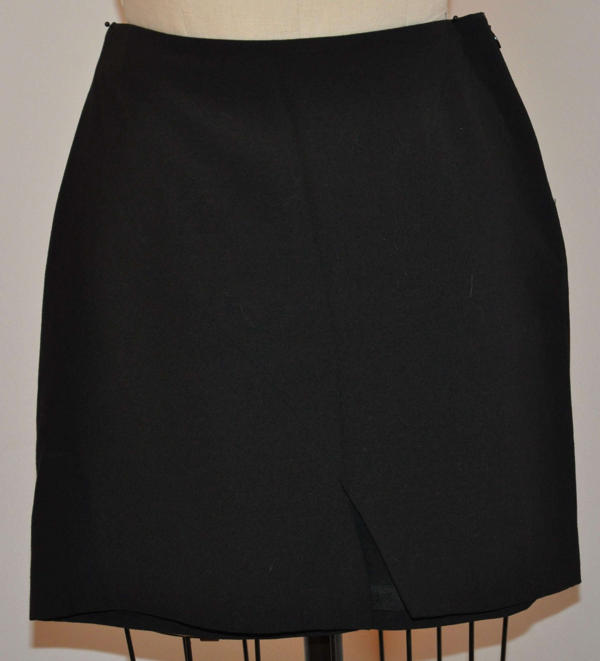 Gucci wonderfully detailed asymmetric jet-black English wool stitched form-fitting mini skirt features asymmetric stitched (on the front side) from right to left, and on the back, from left to right. The center-front asymmetric slit measures 4 1/4